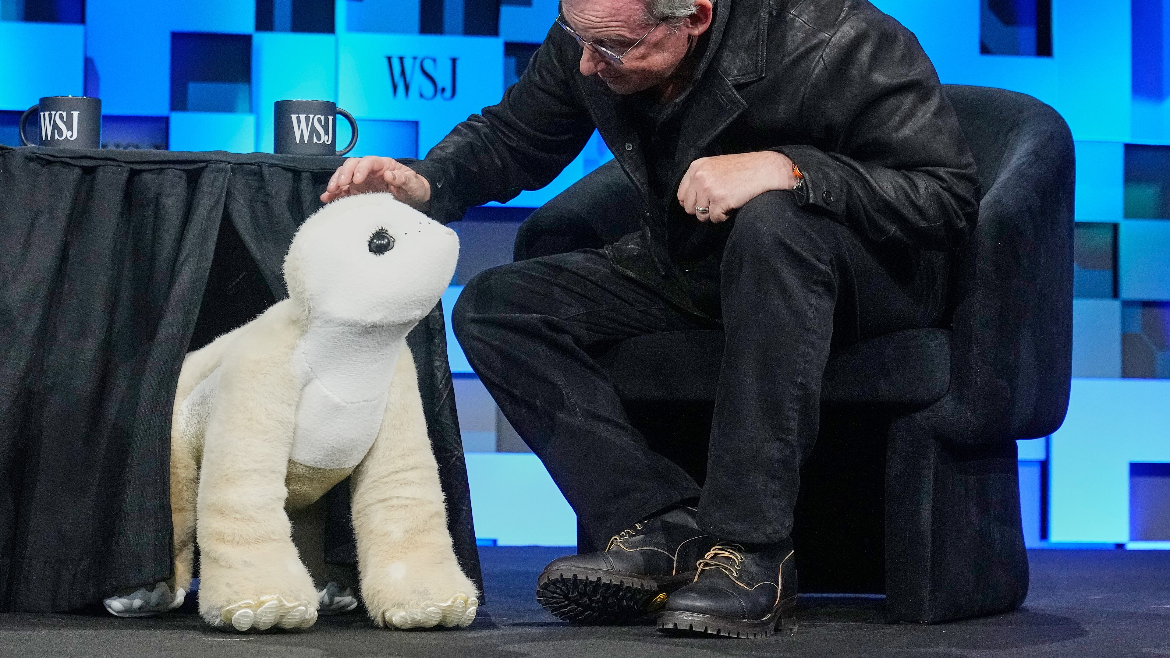 Colin Angle, longtime CEO of Roomba, unveils a four-legged prototype of artificial pet Daphne, called a Familiar, at The WSJ Future of Everything, in New York, Monday, May 4, 2026. (AP Photo/Richard Drew)