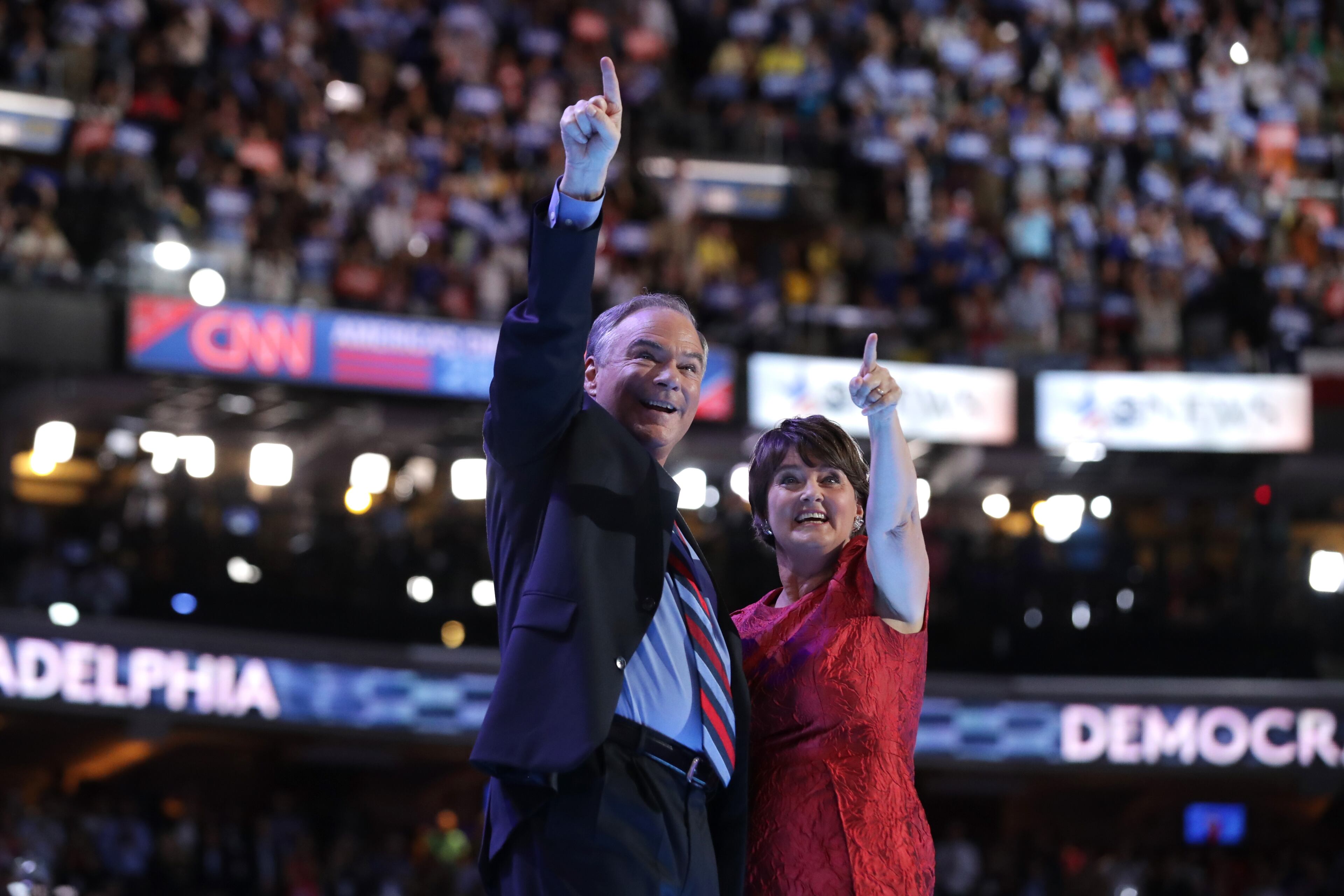 U.S. vice president nominee Tim Kaine along with his wife, Anne Holton, acknowledge the crowd after delivering remarks on the third day of the Democratic National Convention at the Wells Fargo Center, July 27, 2016 in Philadelphia. (Photo by Chip Somodevilla/Getty Images)