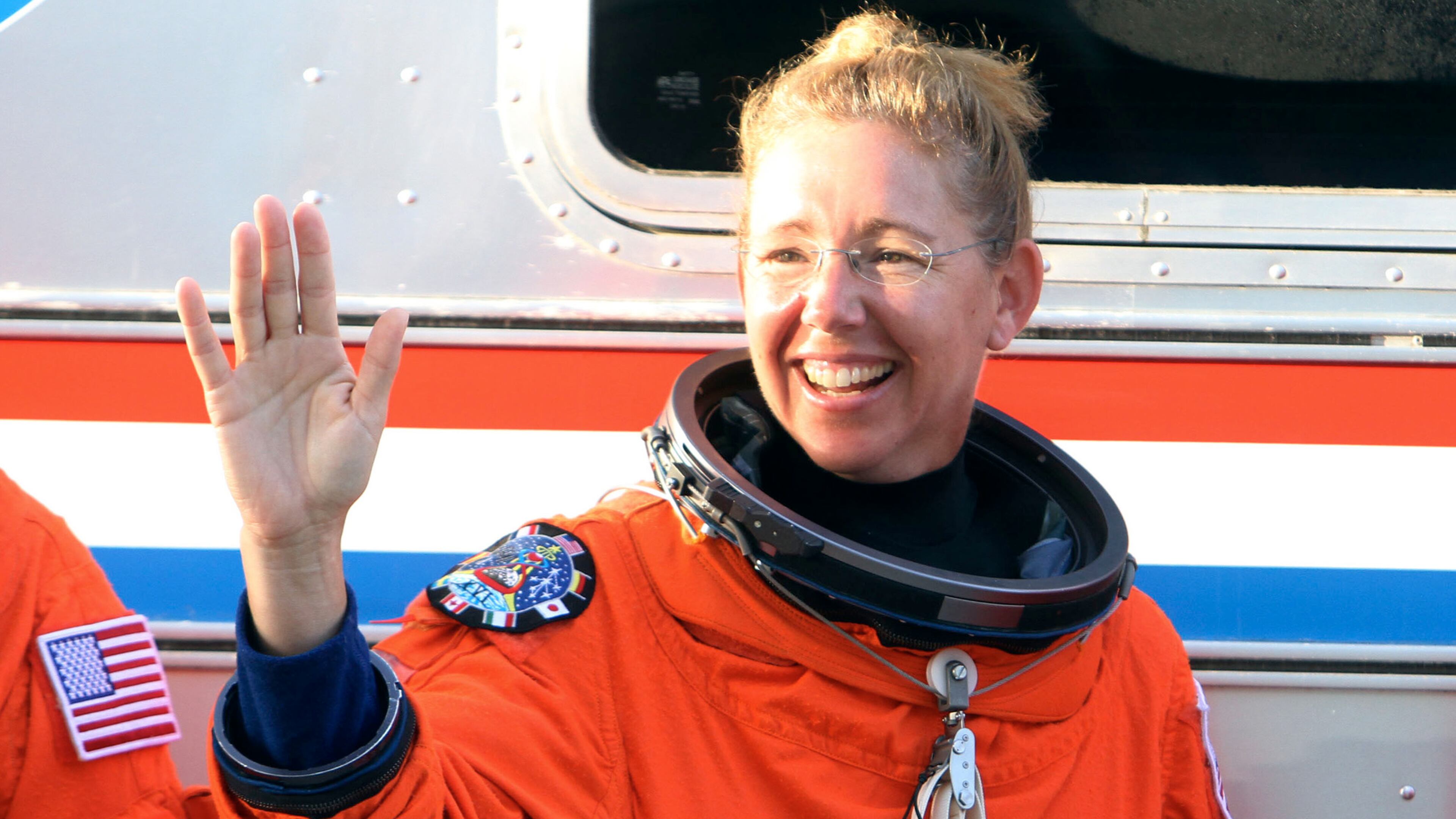 Space shuttle Atlantis, STS-135, astronaut and Georgia Tech grad Sandra Magnus waves Thursday, June 23, 2011 during a launch dress rehearsal at Kennedy Space Center in Florida.