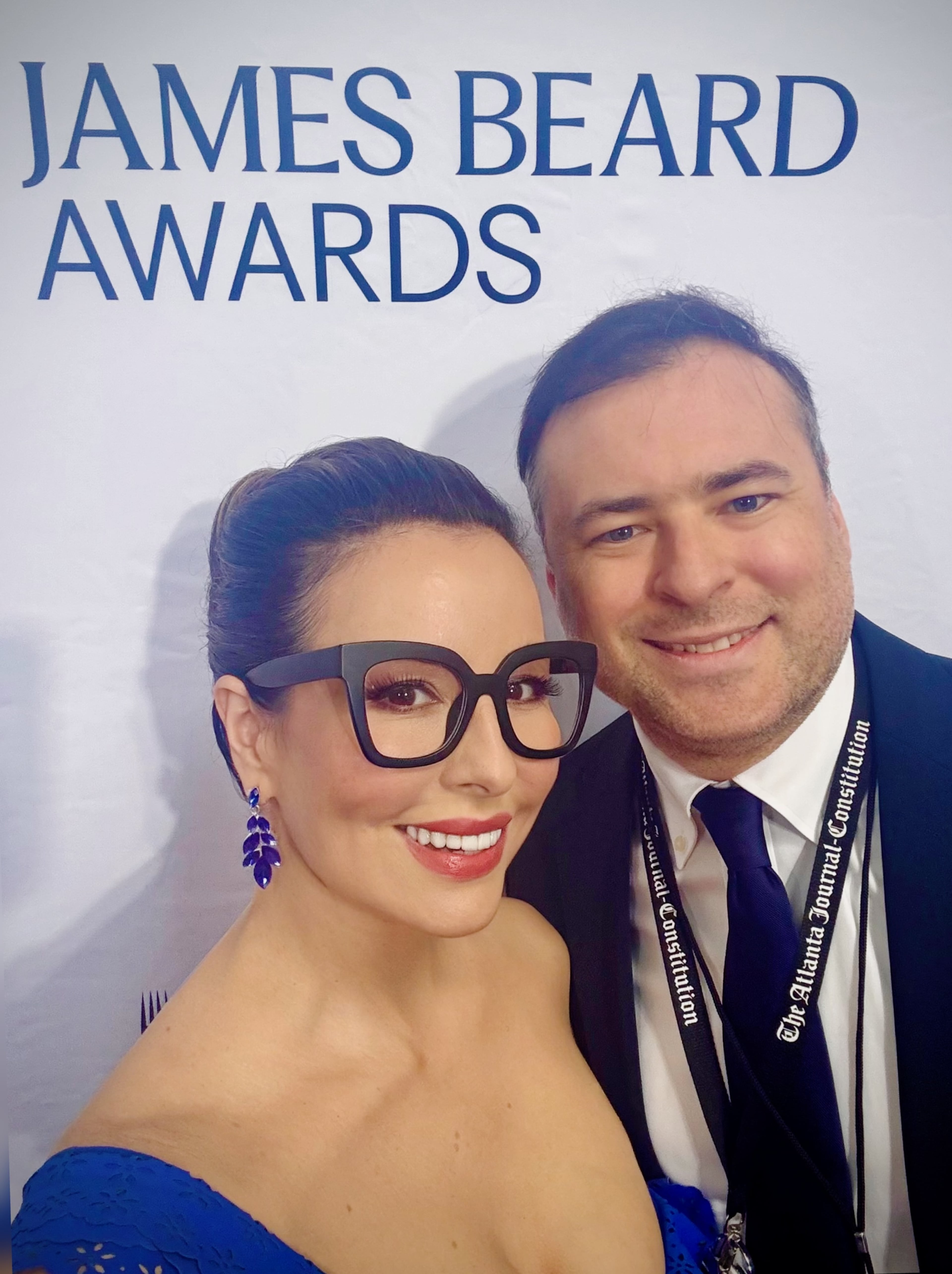 AJC senior editor of food & dining Monti Carlo and AJC restaurant critic Henri Hollis take a selfie on the red carpet at the 2026 James Beard Awards. (Monti Carlo/AJC)
