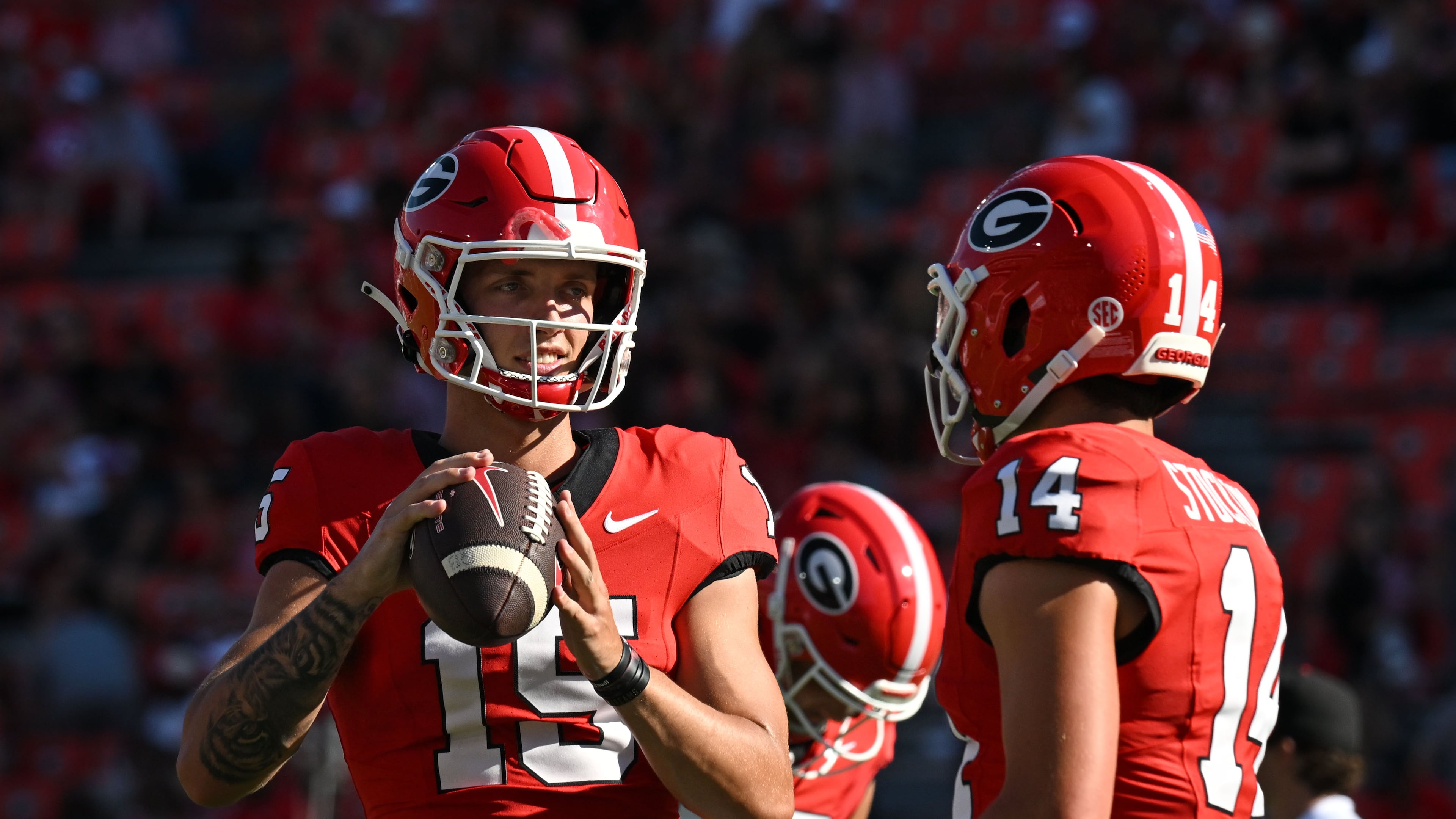 Georgia's quarterback Carson Beck (15) talks to quarterback Gunner Stockton (14) during pregame practice before Georgia home opener against UT Martin in an NCAA football game at Sanford Stadium, Saturday, September 2, 2023, in Athens. (Hyosub Shin / Hyosub.Shin@ajc.com)