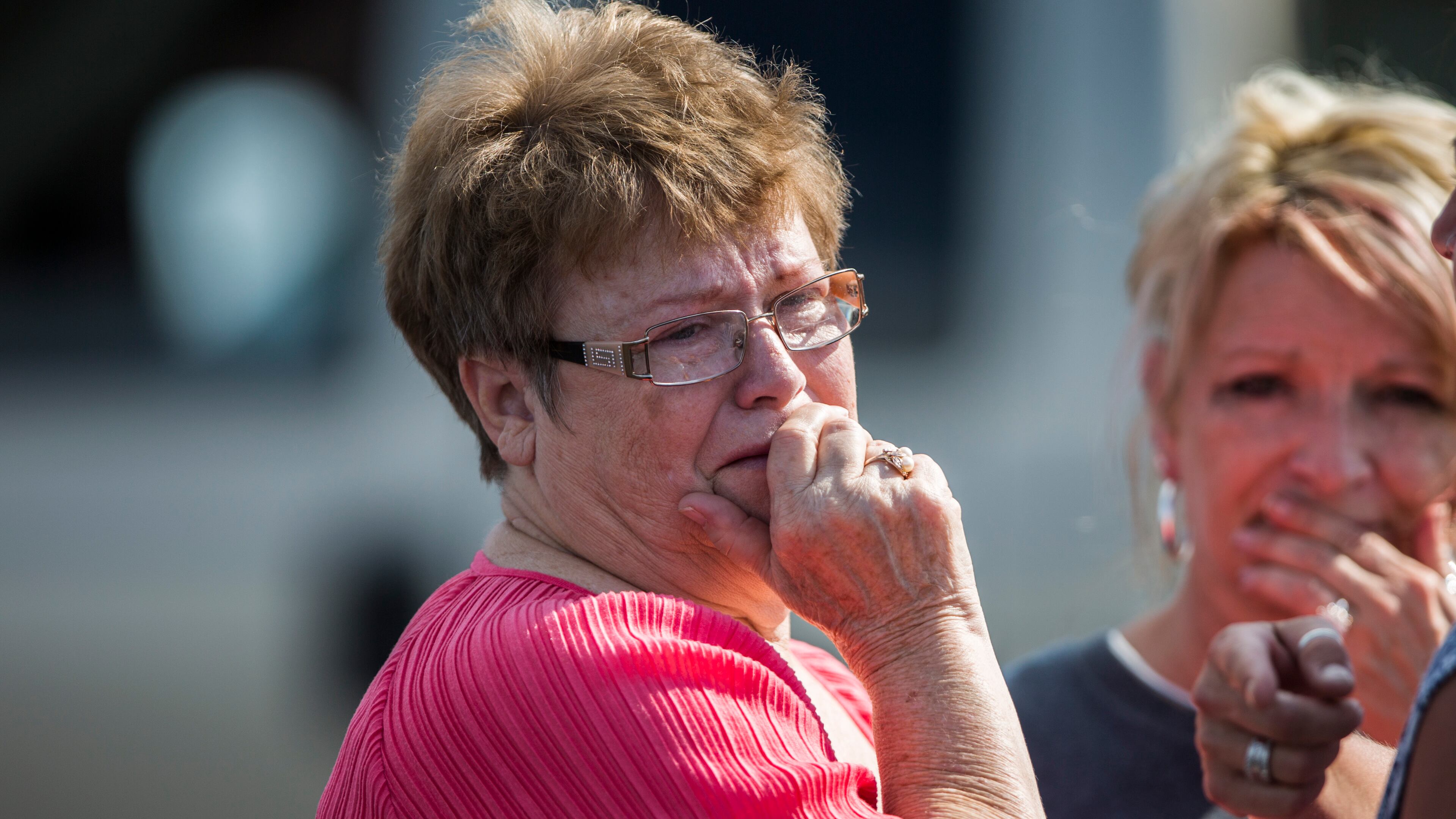 A woman reacts following a shooting at Townville Elementary in Townville Wednesday, Sept. 28, 2016. A teenager killed his father at his home Wednesday before going to the nearby elementary school and opening fire with a handgun, wounding two students and a teacher, authorities said. (Katie McLean/The Independent-Mail via AP)