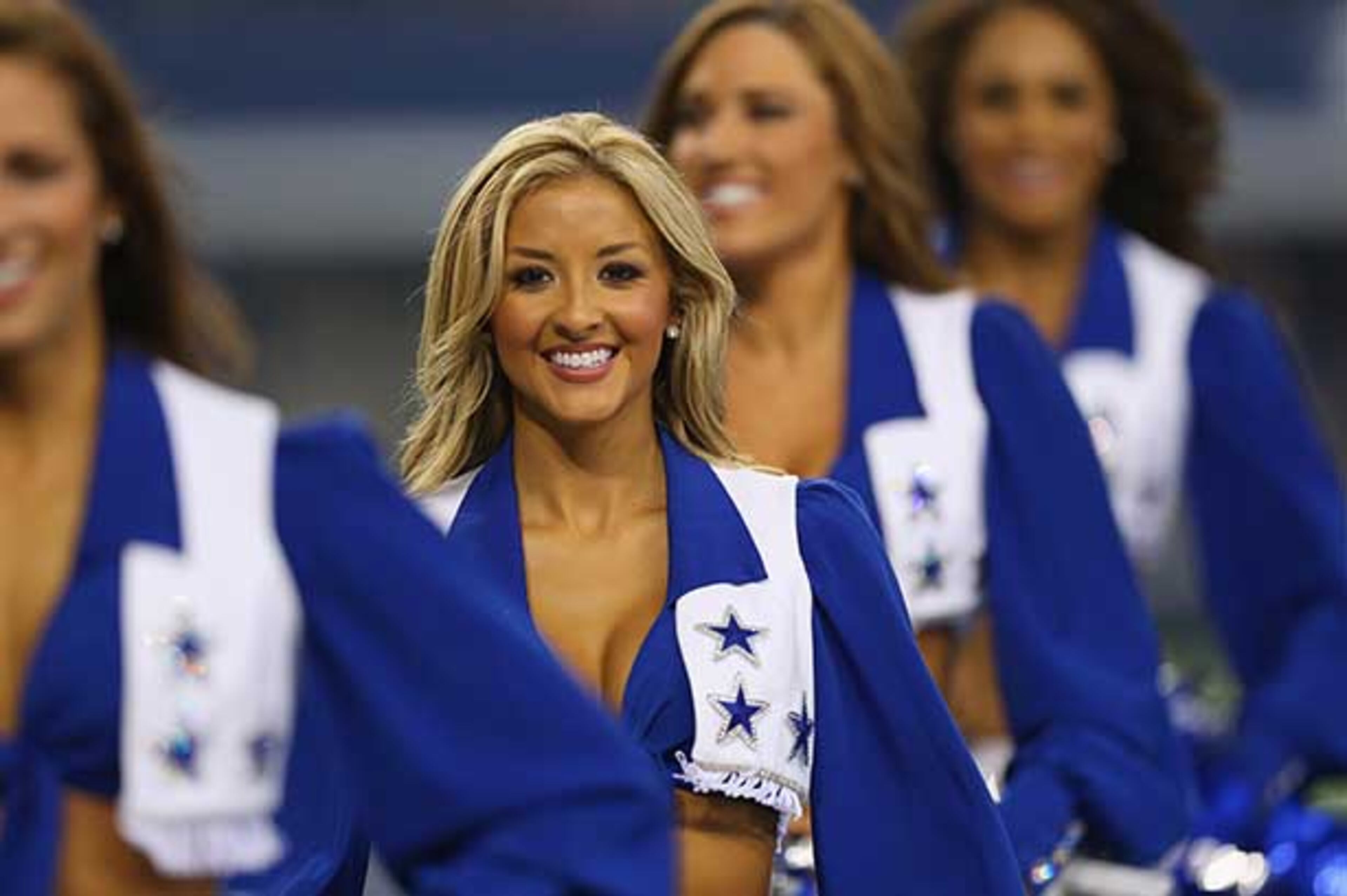 ARLINGTON, TX - AUGUST 24: A Dallas Cowboys Cheerleader performs during a preseason game at AT&T Stadium on August 24, 2013 in Arlington, Texas. (Photo by Ronald Martinez/Getty Images)