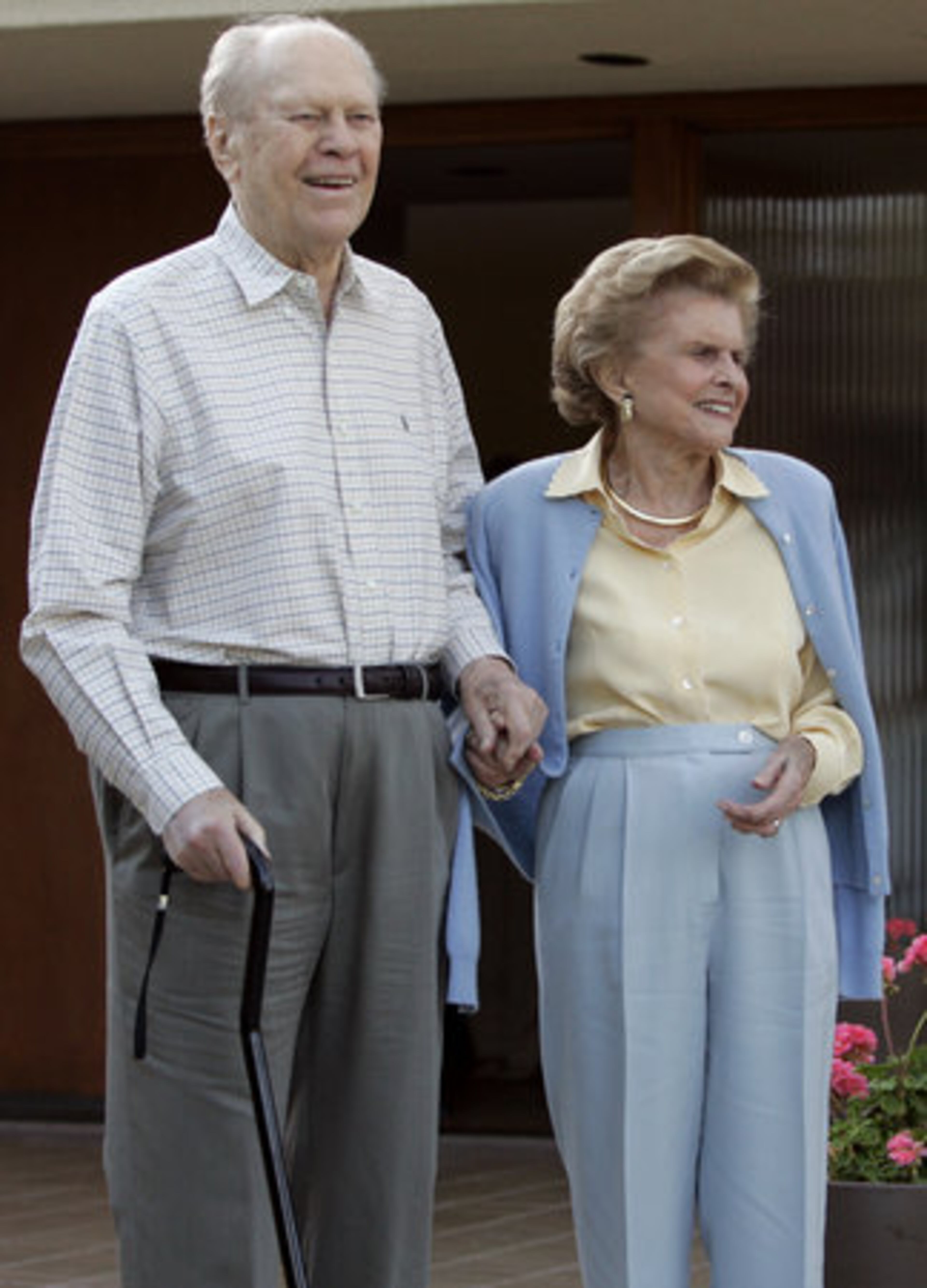 Former President Gerald Ford and former first lady Betty Ford smile in front of their home in Rancho Mirage, Calif. The former first lady died Friday at age 93.
