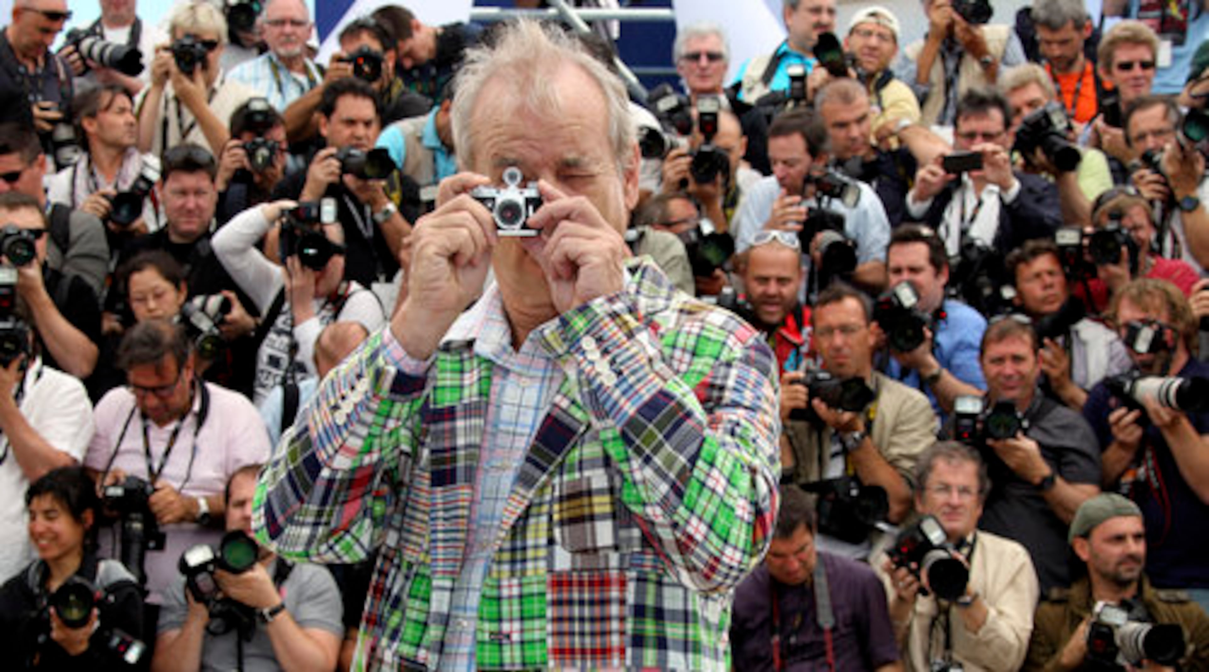 "Moonrise Kingdom" star Bill Murray competes with photographers with his own camera as the 65th annual Cannes Film Festival kicks off Wednesday in Cannes, southern France, with the opening night premiere of the Wes Anderson film.