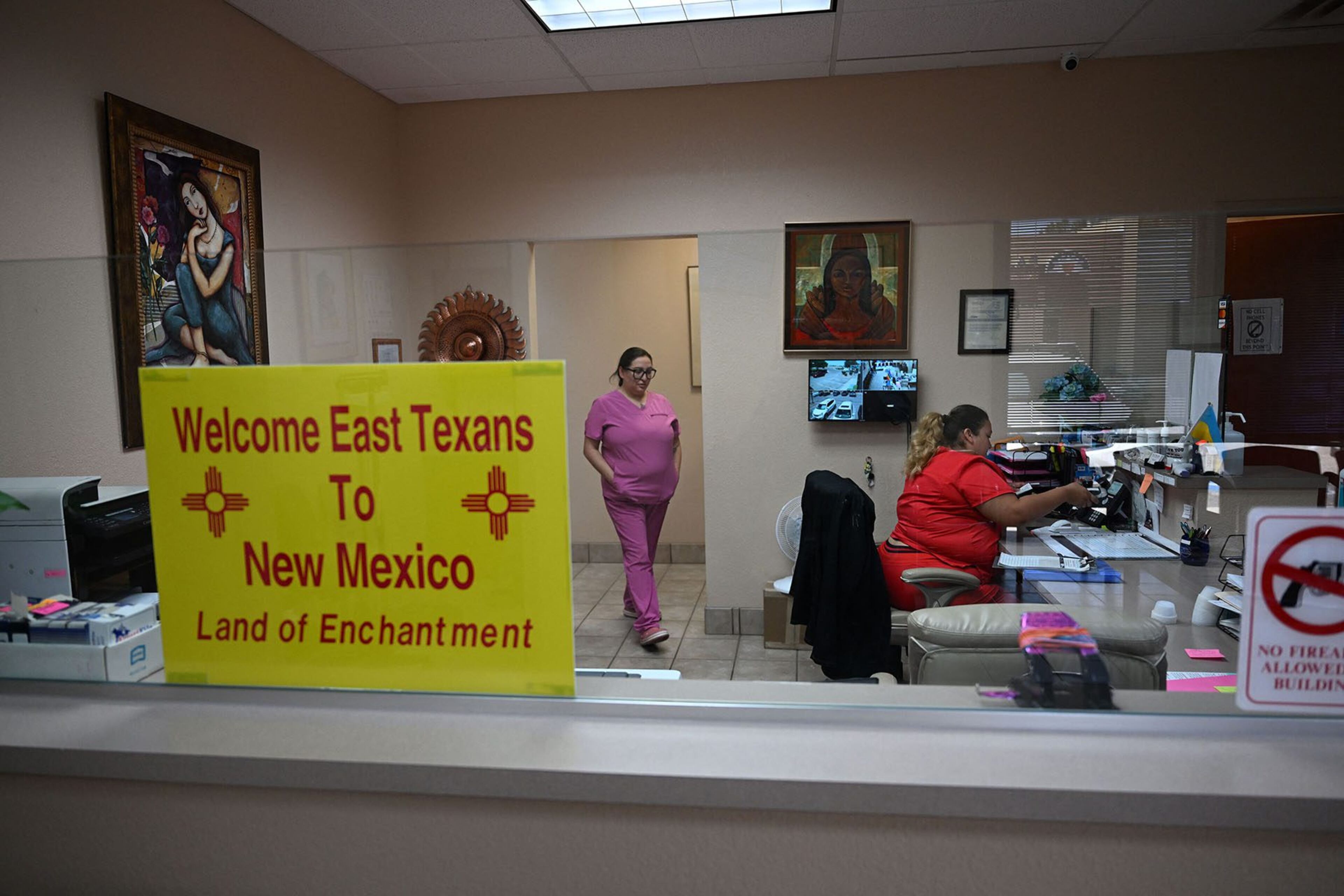 A sign welcoming patients from East Texas is displayed in the waiting area of the Women’s Reproductive Clinic in Santa Teresa, New Mexico, in June 2022. (ROBYN BECK/AFP/GETTY IMAGES)