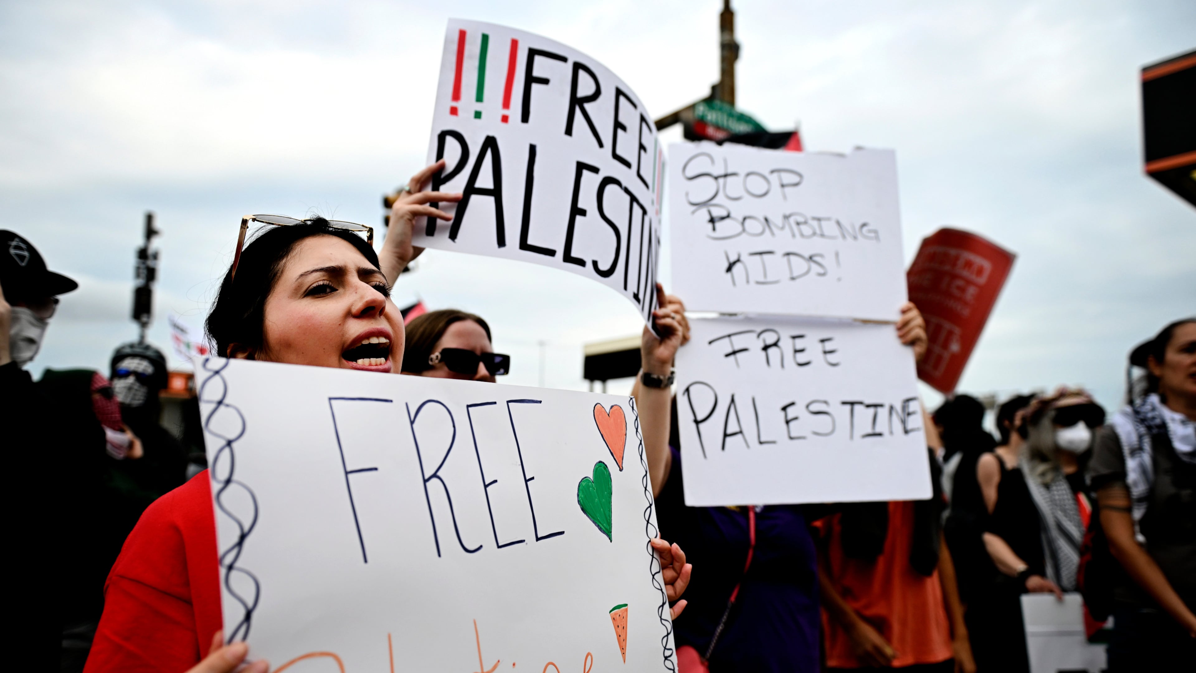 Pro-Palestinian demonstrators hold signs during a "Free Palestine" protest before an Ed Sheeran concert in Philadelphia, Saturday, Sept. 19, 2026. (AP Photo/Allie Ippolito)