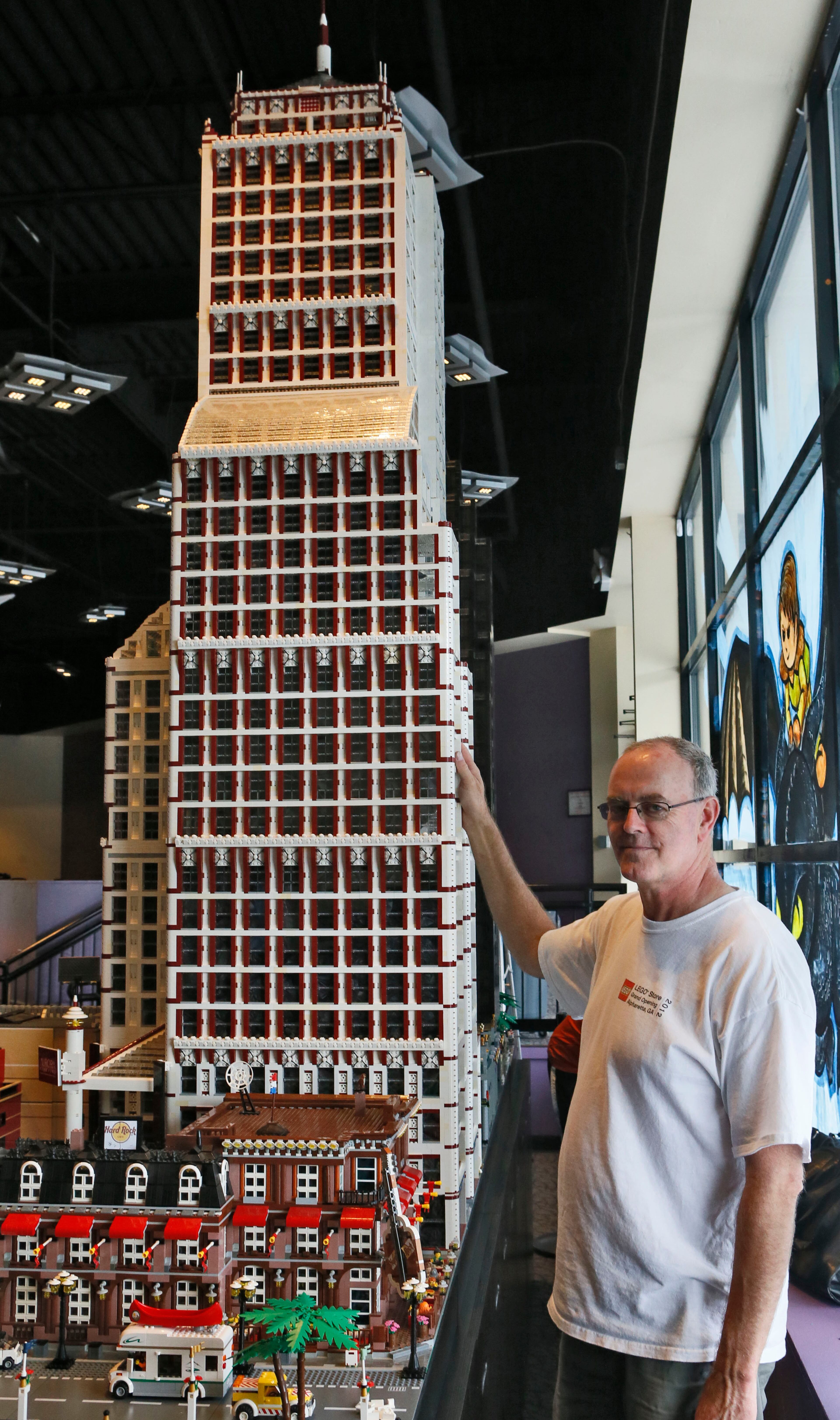 The tallest buildings in the display tower over Harry Nijenkamp.