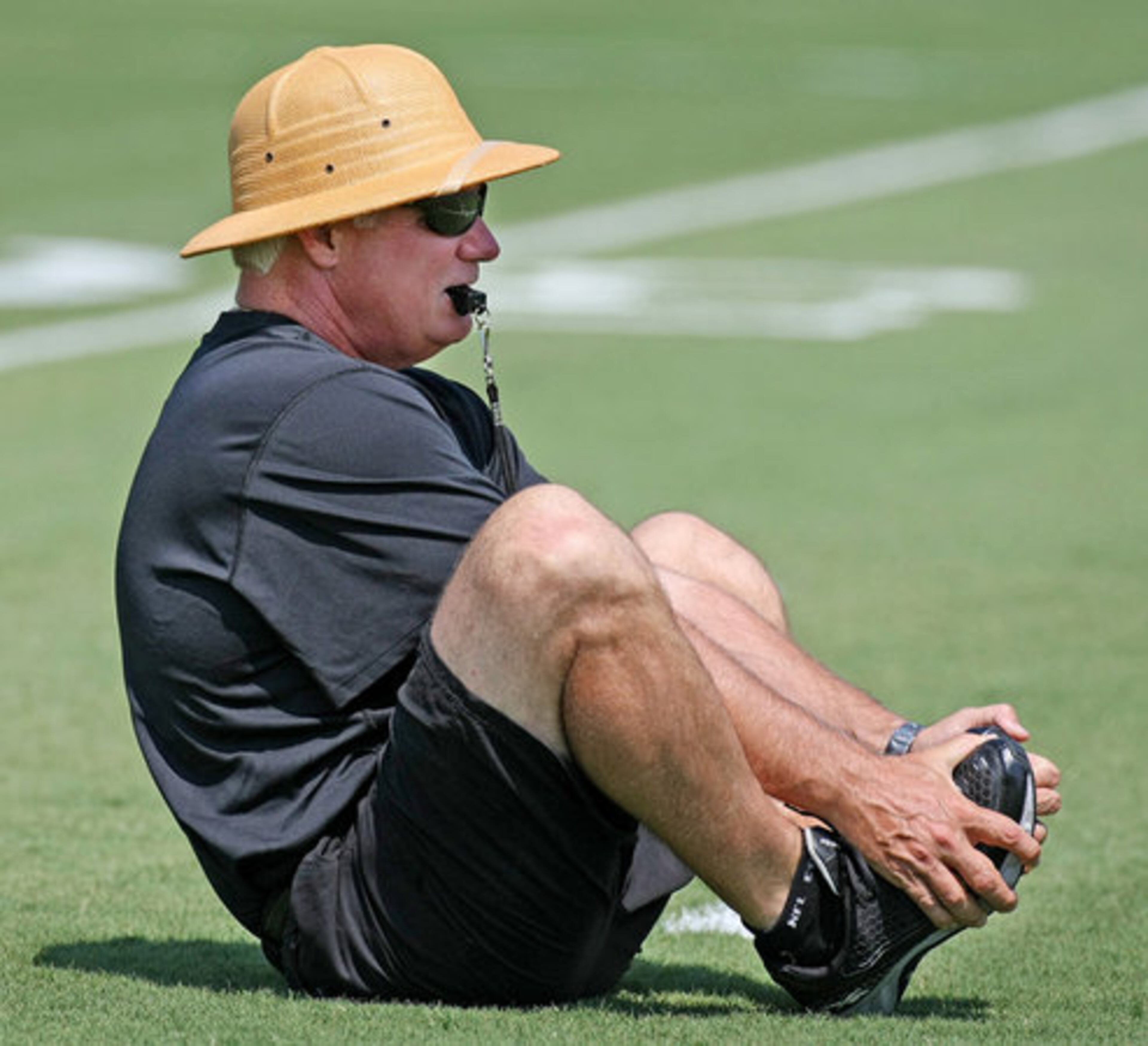 Falcons head coach Mike Smith loosens up with the team as they prepare for the afternoon practice. The Falcons on Wednesday will hold just one practice after four days of two-a-days.