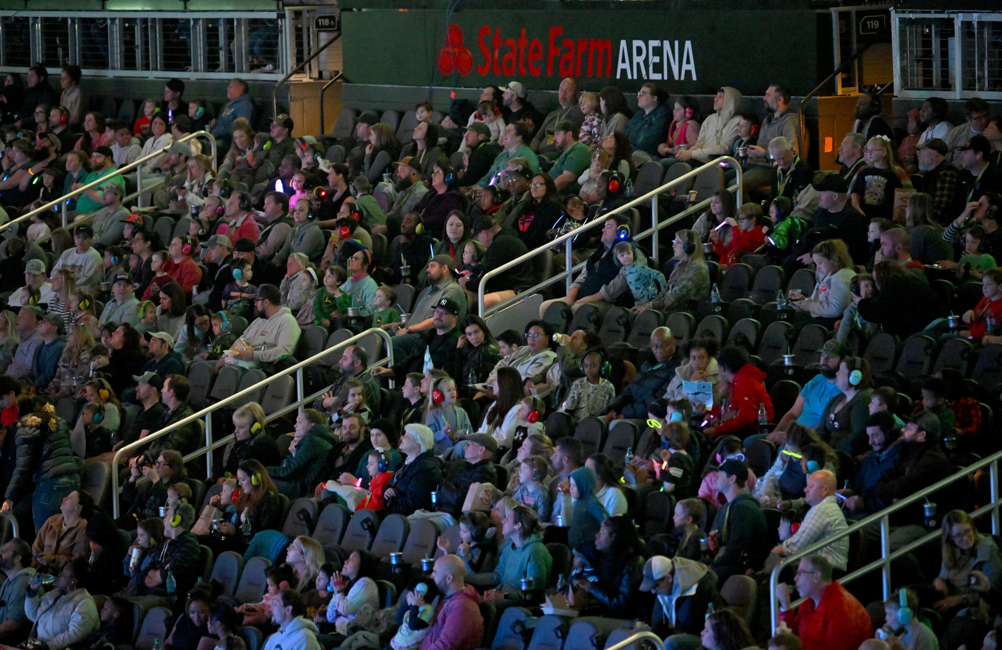 Fans enjoy during Hot Wheels Monster Trucks Live at State Farm Arena, Saturday, December 6, 2024, in Atlanta. (Hyosub Shin / Hyosub.Shin@ajc.com)