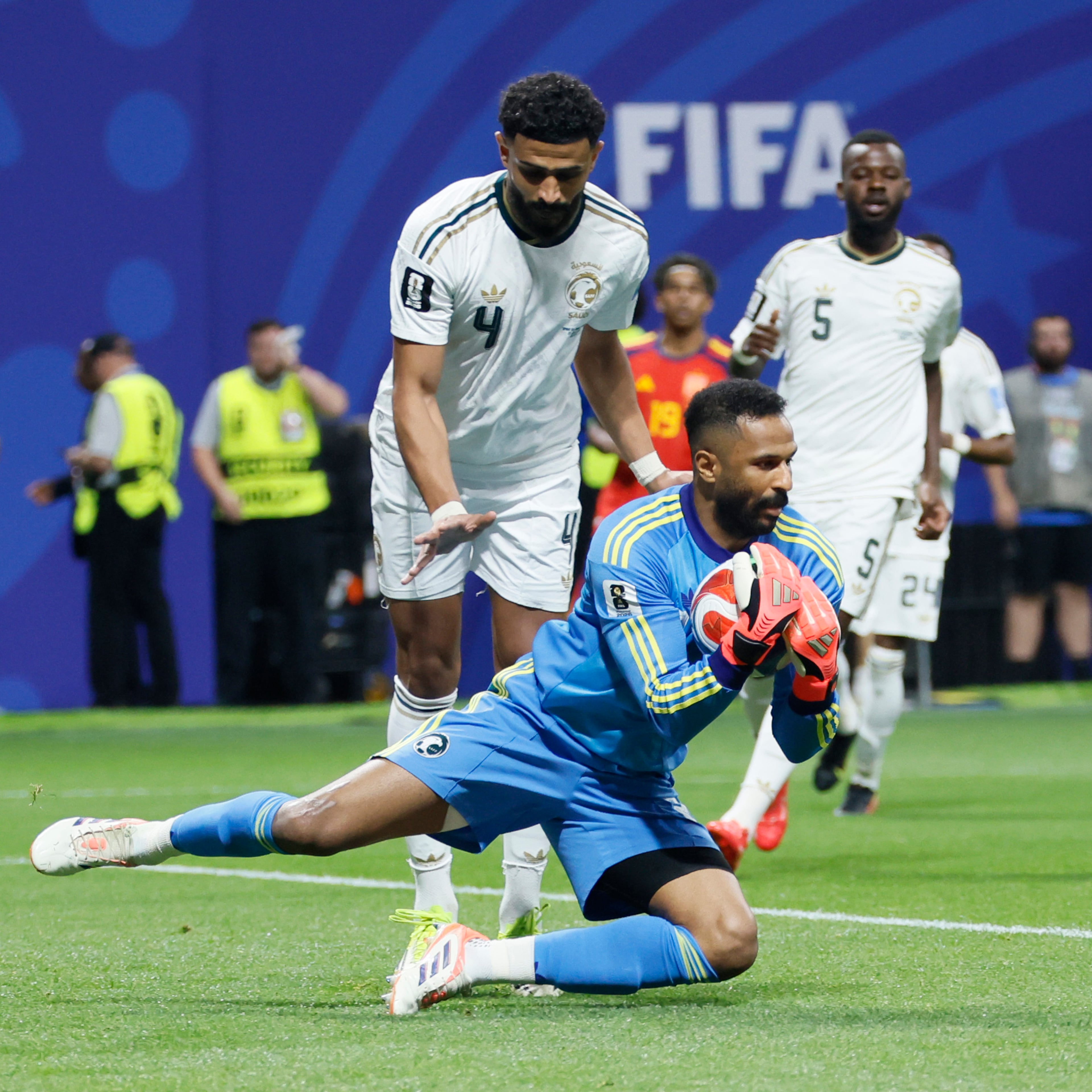 Saudi Arabia goalkeeper Mohammed Al-Owais (bottom center) makes a save near teammates Abdulelah Al-Amri (left) and Hassan Al-Tambakti early in the first half of the Spain vs. Saudi Arabia World Cup match Sunday, June 21, 2026, at Atlanta Stadium. (Miguel Martinez/AJC)