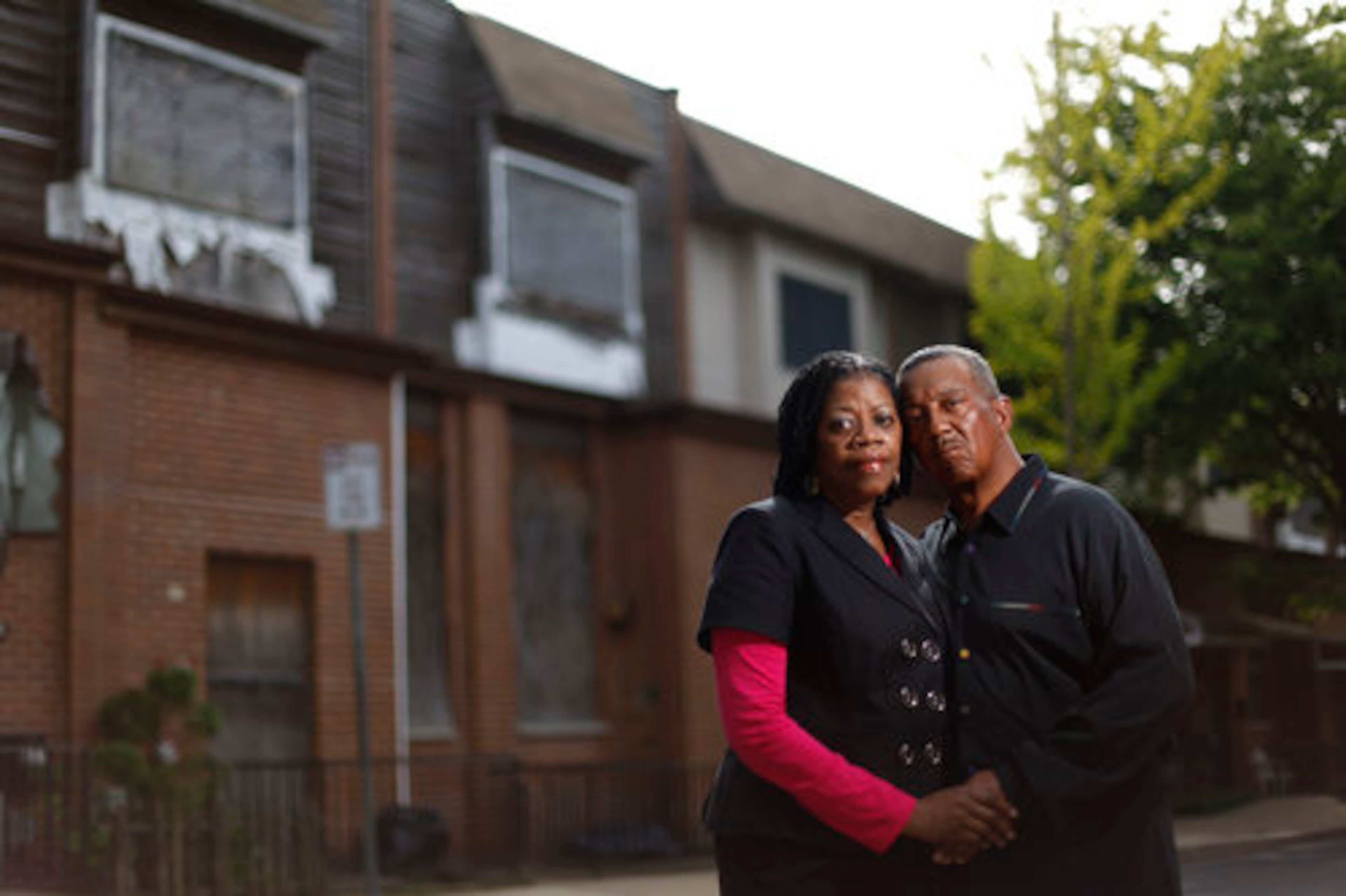 Connie Renfrow and her husband Gerald Renfrow pose for a photograph on the street near their Osage Avenue home in Philadelphia. Their house was one of scores rebuilt after police dropped a bomb on the block in 1985 in an attempt to arrest members of the militant group MOVE.