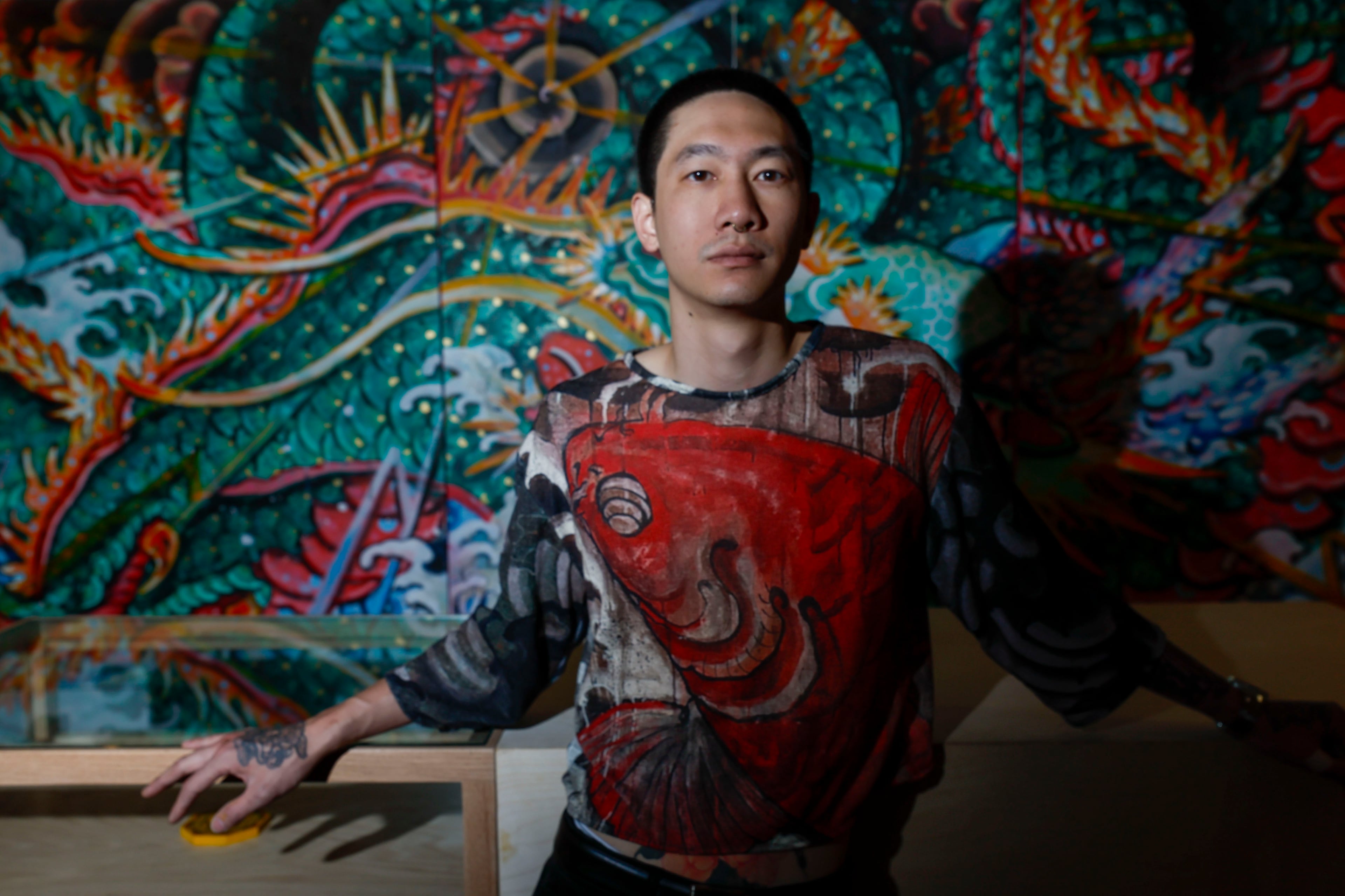 “To me, Andrew has a lot of aura," fellow artist Perlizbeth De Leon said of the organizer of Blooms Chinatown Market. "Not just him as a person; you can feel it radiating from his work.” (Miguel Martinez/AJC)