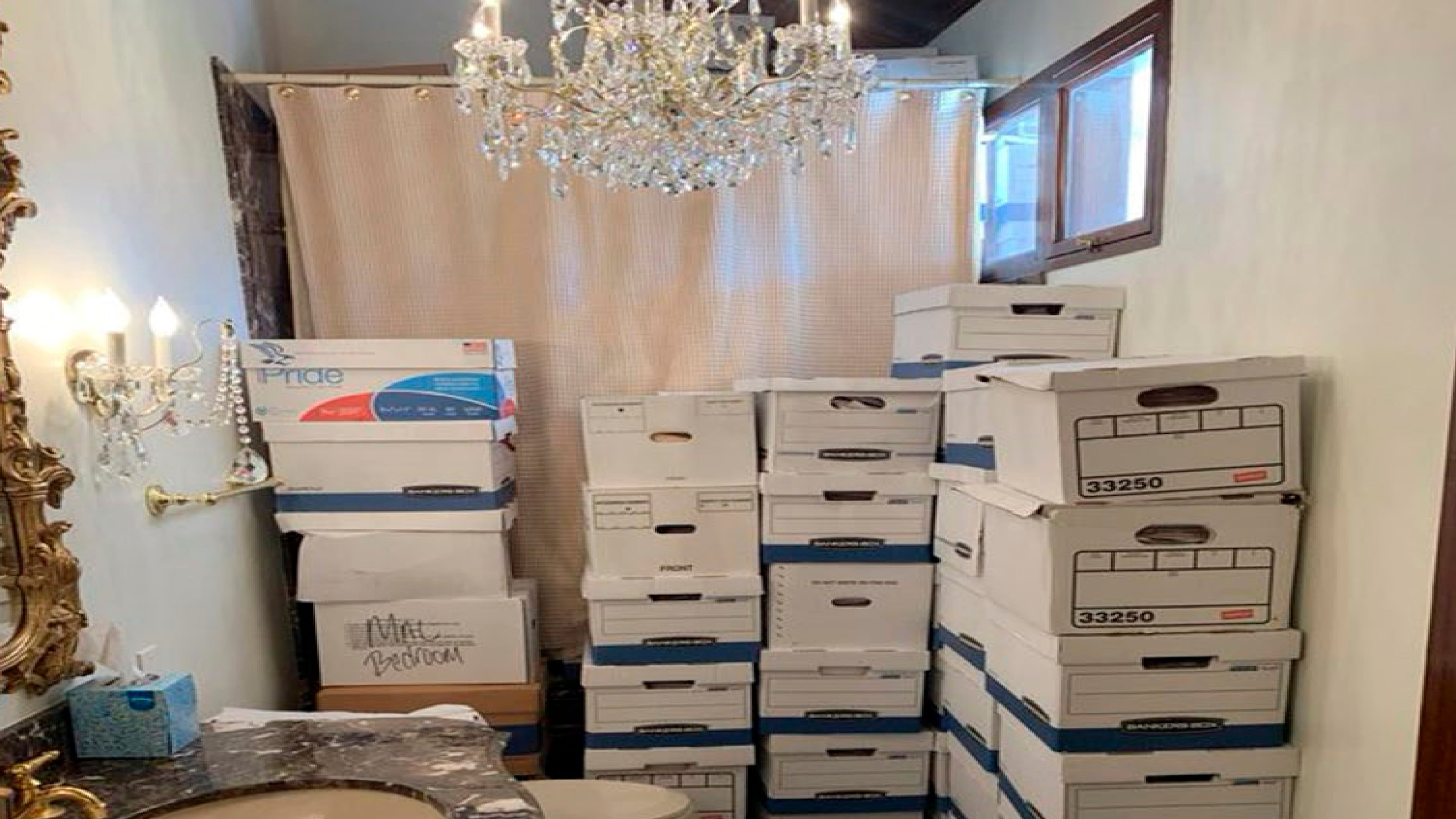 FILE - This image, contained in the indictment against former President Donald Trump, shows boxes of records stored in a bathroom and shower in the Lake Room at Trump's Mar-a-Lago estate in Palm Beach, Fla. (Justice Department via AP)