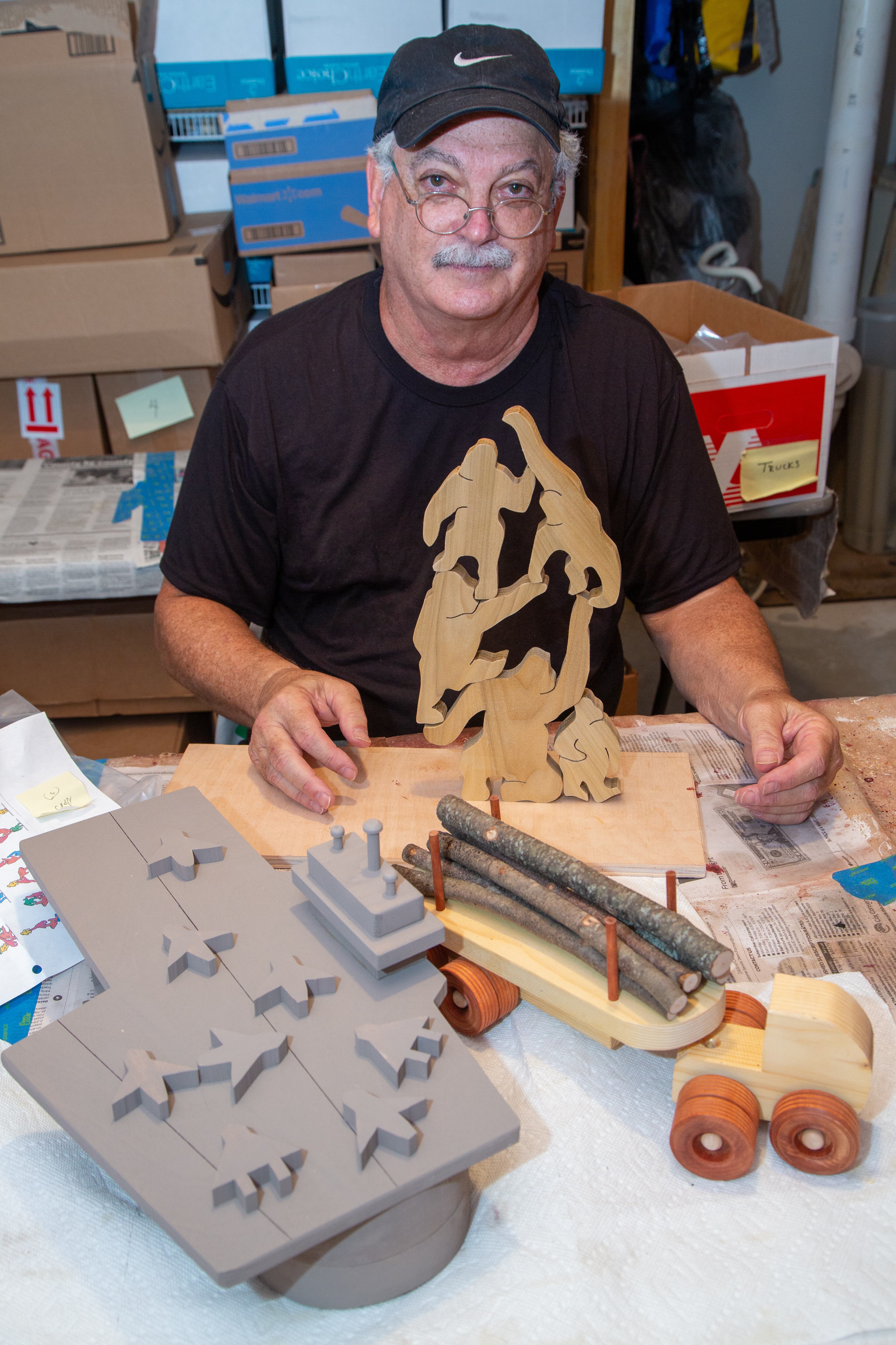 Portrait of Jon Saulson with some of his woodworking creations he made in the basement of his Snellville home. When Dr. Saulson retired as an educator, he got into woodworking making toys, puzzles, games, figurines and art out of wood. Numerous people and groups wanted him to do craft shows with them, but it turned his joy into "work." So for the past 10 years, he has donated loads of his creations to several people and agencies that might need them for the children and families they serve. In return, he gets the pure joy, satisfaction, a sense of making others happy. (Phil Skinner for The Atlanta Journal-Constitution)