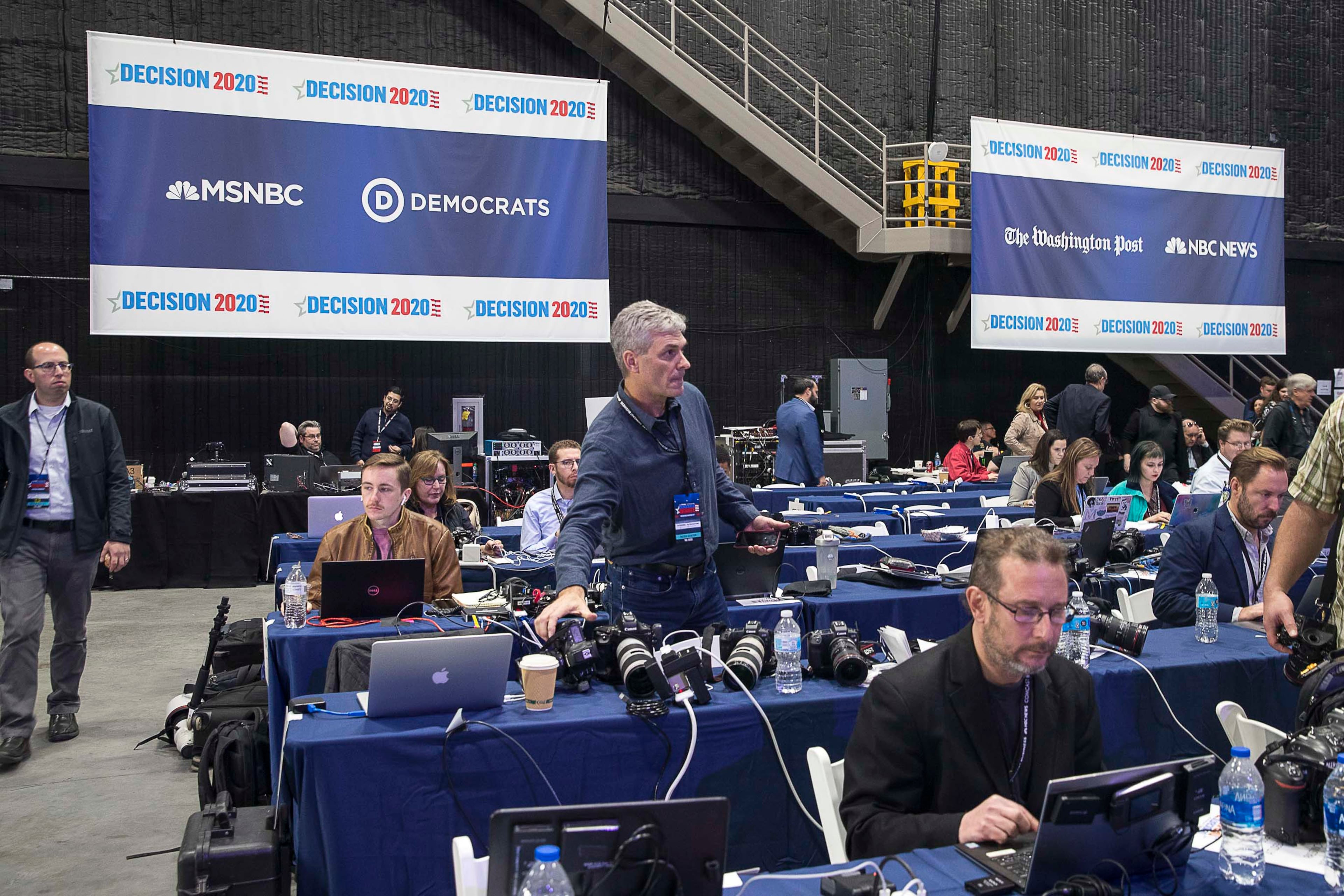 11/20/2019 -- Atlanta, Georgia -- Journalists work inside the media room before the start of the MSNBC/The Washington Post Democratic Presidential debate at Tyler Perry Studios, Monday, November 20, 2019. (Alyssa Pointer/Atlanta Journal Constitution)