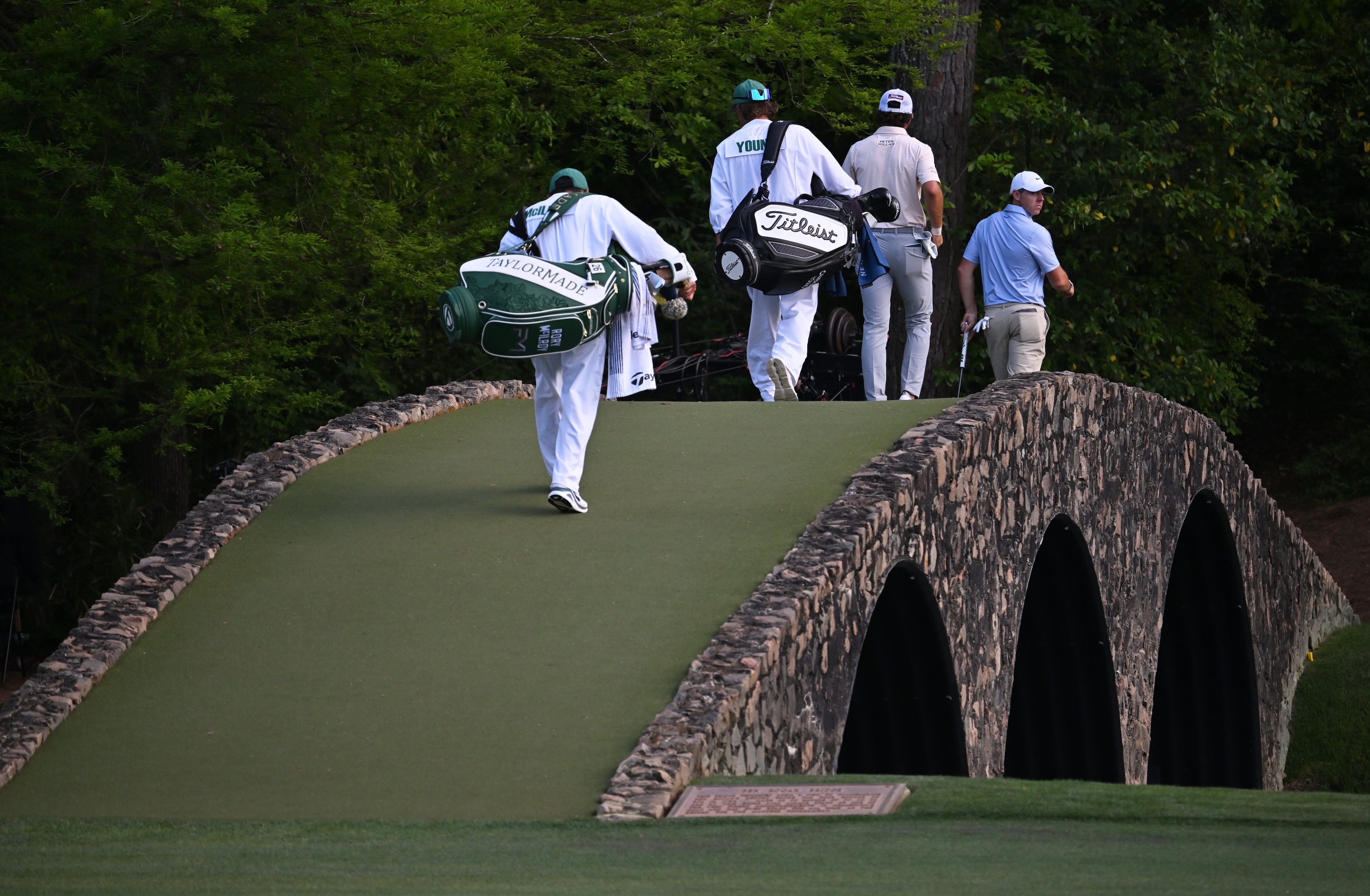 Rory McIlroy looks back as he walks over bridge headed to the 12th tee during final round of the Masters, at Augusta National Golf Club, Sunday, April 12, 2026, in Augusta, GA (Hyosub Shin/AJC)