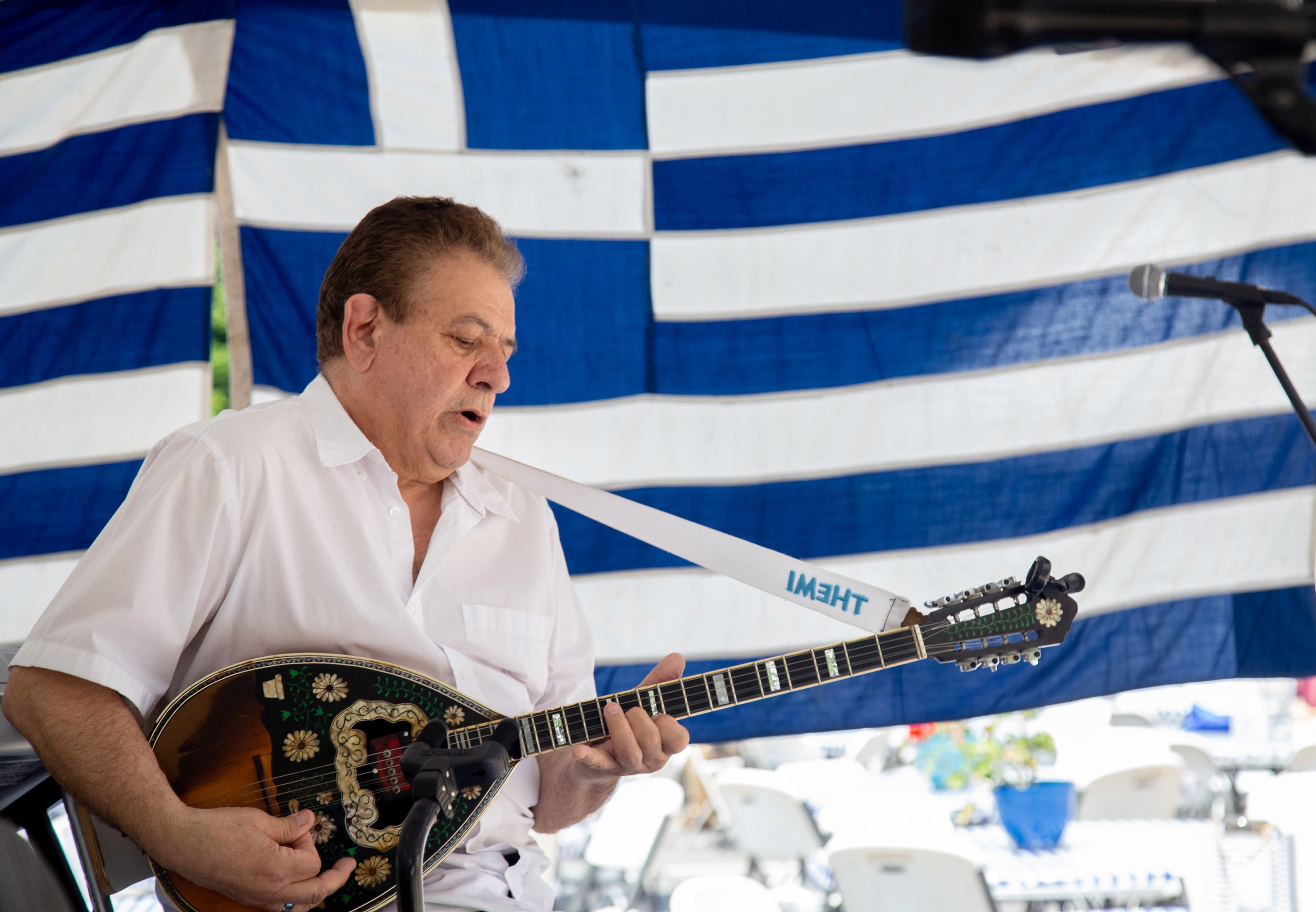 Themi Kakias plays the bouzouki with the Georga Karras band during the 29th annual Marietta Greek Festival on Saturday, May 18, 2019. STEVE SCHAEFER / SPECIAL TO THE AJC