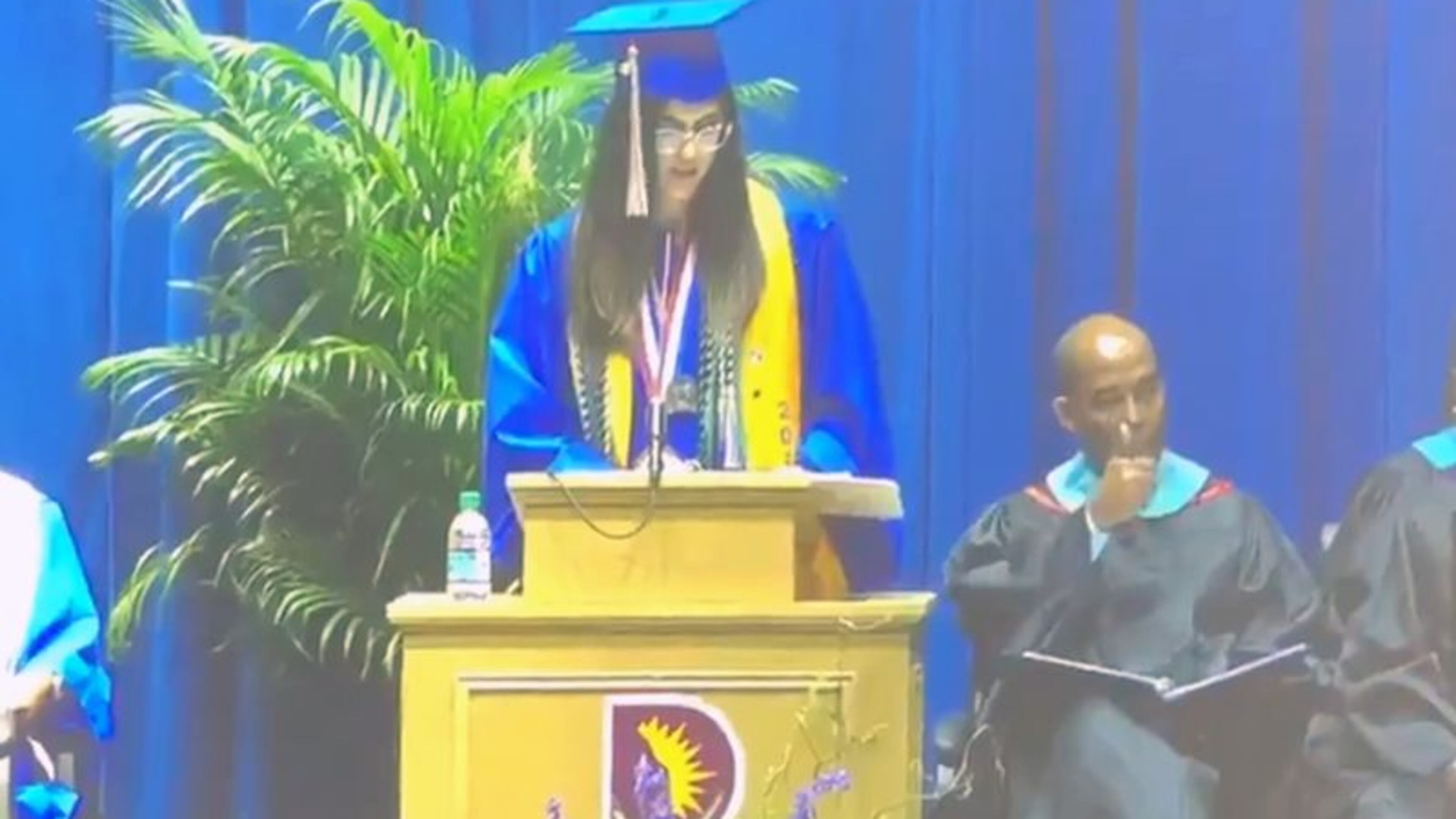 Emmett J. Conrad High School senior Rooha Haghar posted a video on Twitter that appeared to show her principal signaling her microphone to be silenced after she began talking about victims of injustice, including Trayvon Martin and Tamir Rice.