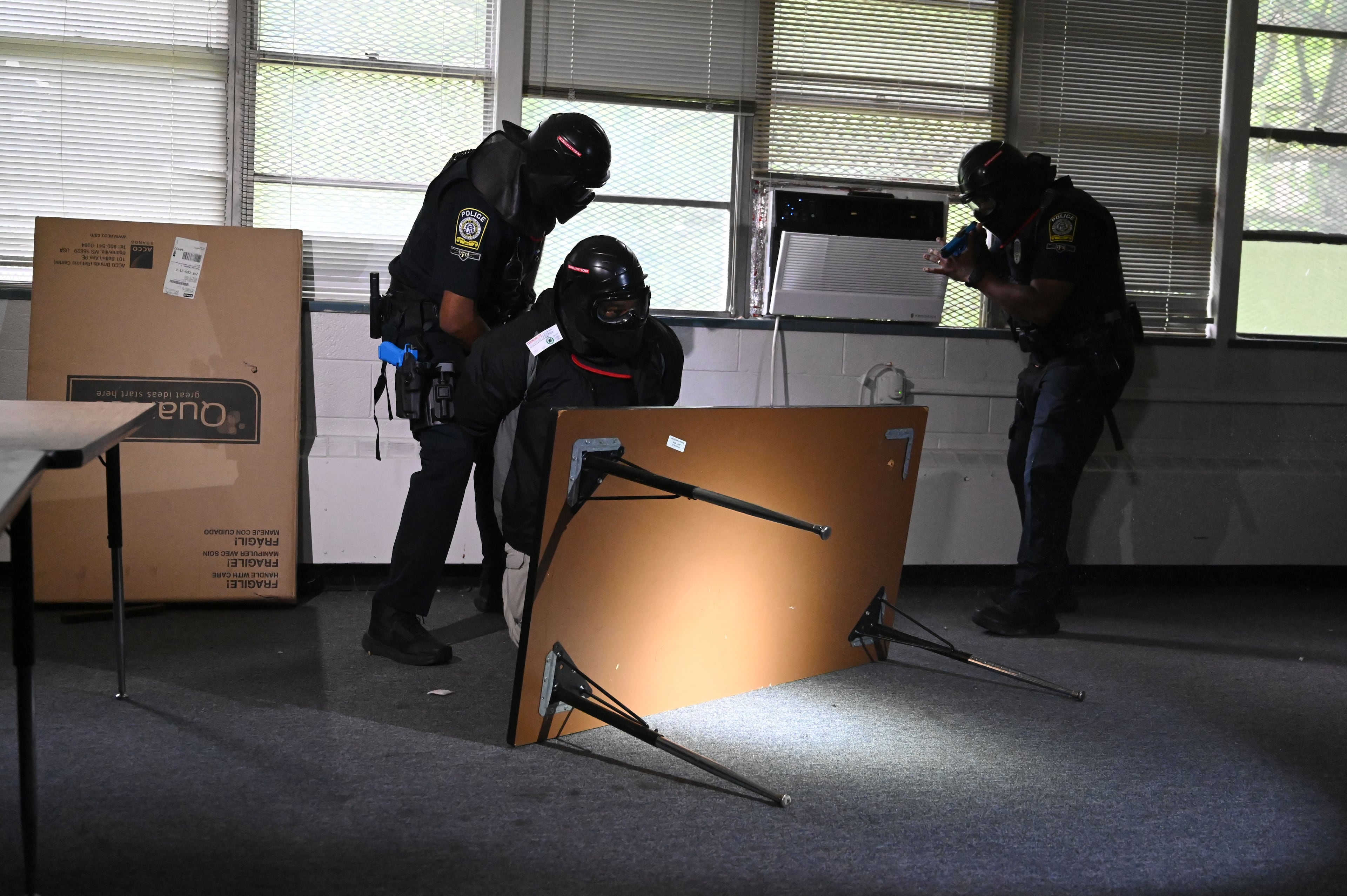 Atlanta Public Schools' new tactical team apprehends a suspect during a training drill on Tuesday, July 21, 2026, in Atlanta. (Hyosub Shin/AJC)
