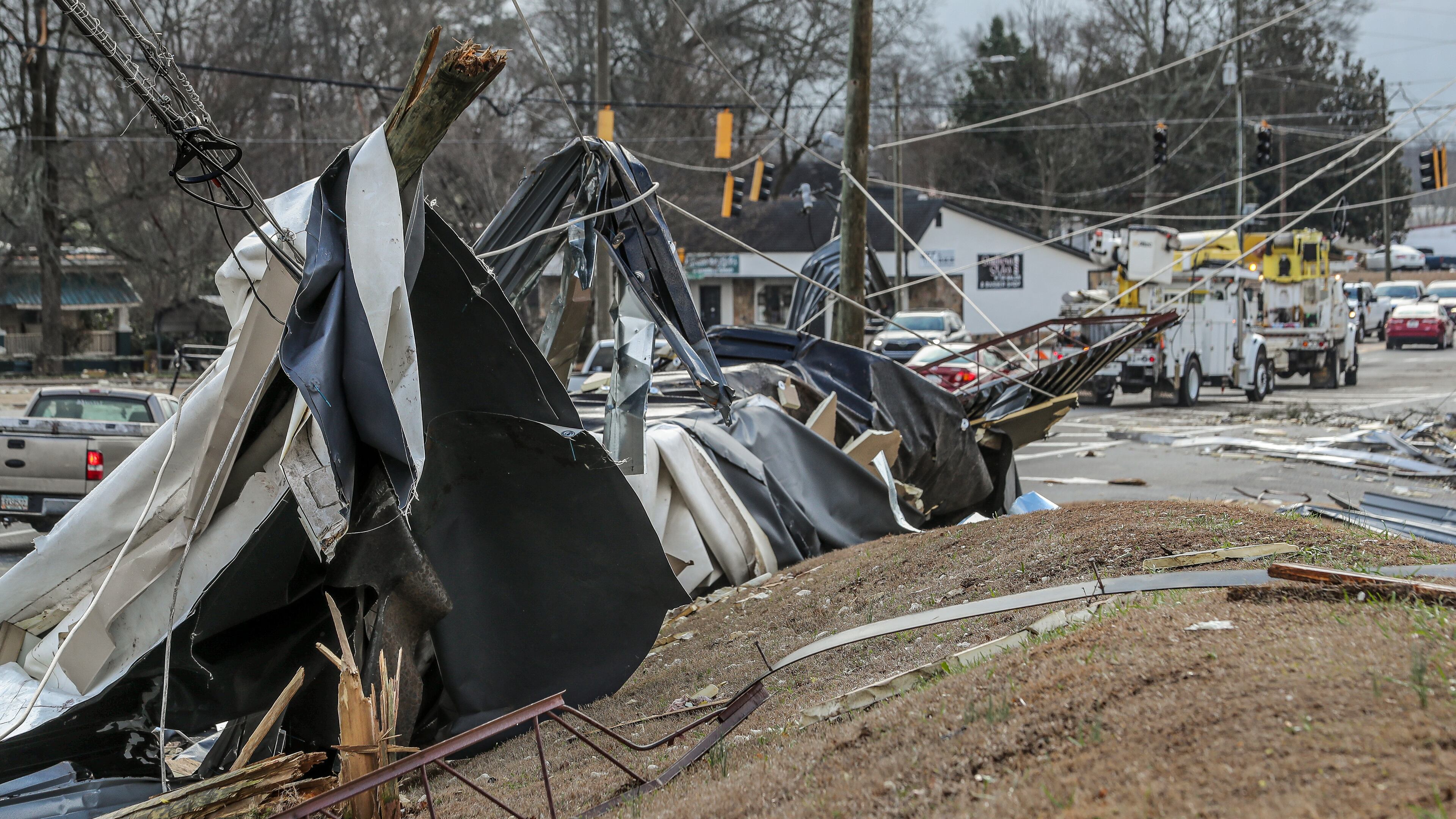 January 13, 2023 Spalding County: Traffic crawled along McIntosh Road in Griffin, Georgia on Friday, Jan. 13, 2023 following violent overnight storms. Gov. Brian Kemp said the powerful storms that swept through Georgia on Thursday killed at least two people and injured dozens, as he urged residents in damaged areas to stay clear of emergency crews working to repair power and remove debris. Authorities have traced at least four confirmed tornado tracks in Georgia. In Troup County, at least 50 homes were severely damaged, Stallings said. In Spalding County, another 130 people took refuge in an emergency shelter. Officials warned nearby residents that debris and fallen power lines are blocking crews from restoring power. Stallings urged them to stay where they are to avoid interfering with crews – and to be vigilant for falling debris that could cause more harm. (John Spink / John.Spink@ajc.com)