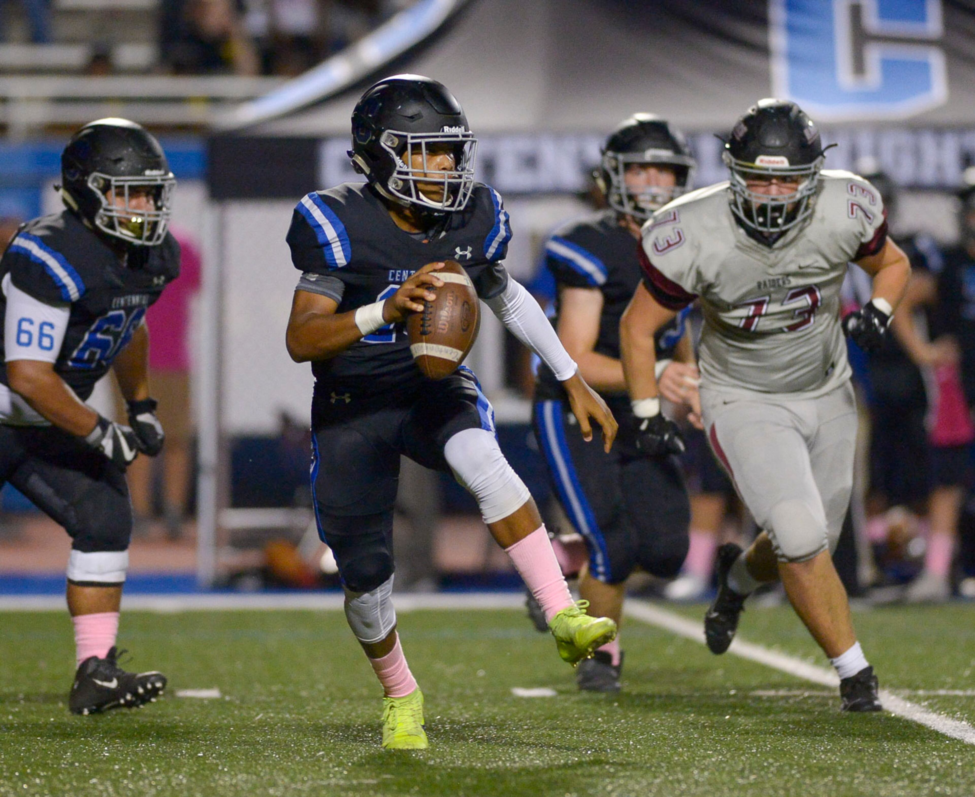 Centennial quarterback Zaire Goff (10) scrambles to avoid Alpharetta's defense in the first half of Friday's game at Centennial. (Daniel Varnado/Special)