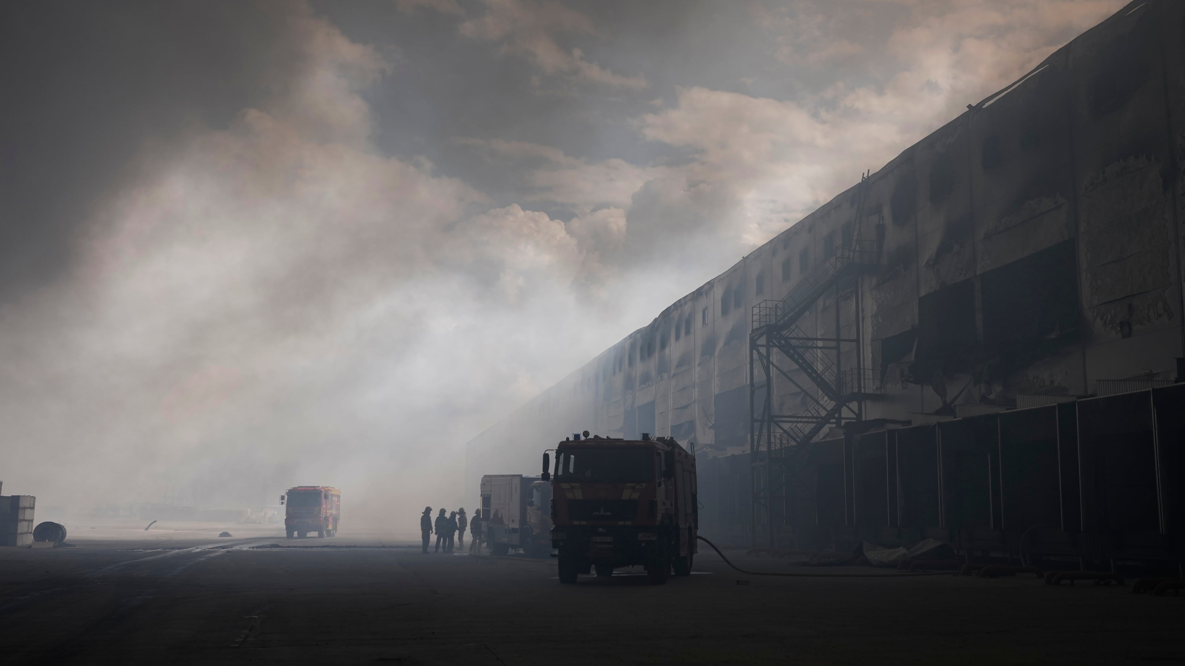 Smoke rises above warehouse stores after a Russian air attack in Kyiv, Ukraine, Thursday, Aug. 27, 2026. (AP Photo/Efrem Lukatsky)
