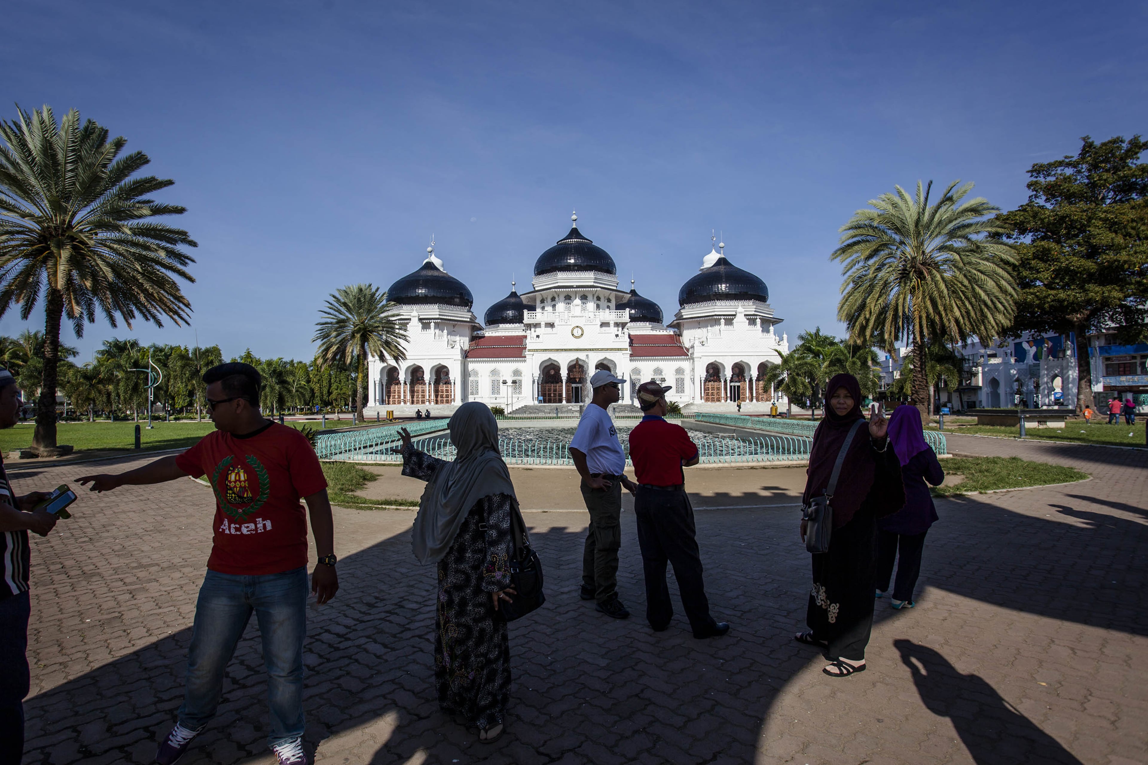 BANDA ACEH, INDONESIA - DECEMBER 11: People gather near the Grand Mosque prior to the ten year anniversary of the 2004 earthquake and tsunami on December 11, 2014 in Banda Aceh, Indonesia. Aceh was the worst hit location, being the closest major city to the epicentre of the 9.1 magnitude quake, suffering a huge hit from the following tsunami and resulting in around 130,000 deaths. Throughout the affected region of eleven countries, nearly 230,000 people were killed, making it one of the deadliest natural disasters in recorded history. (Photos by Ulet Ifansasti/Getty Images)
