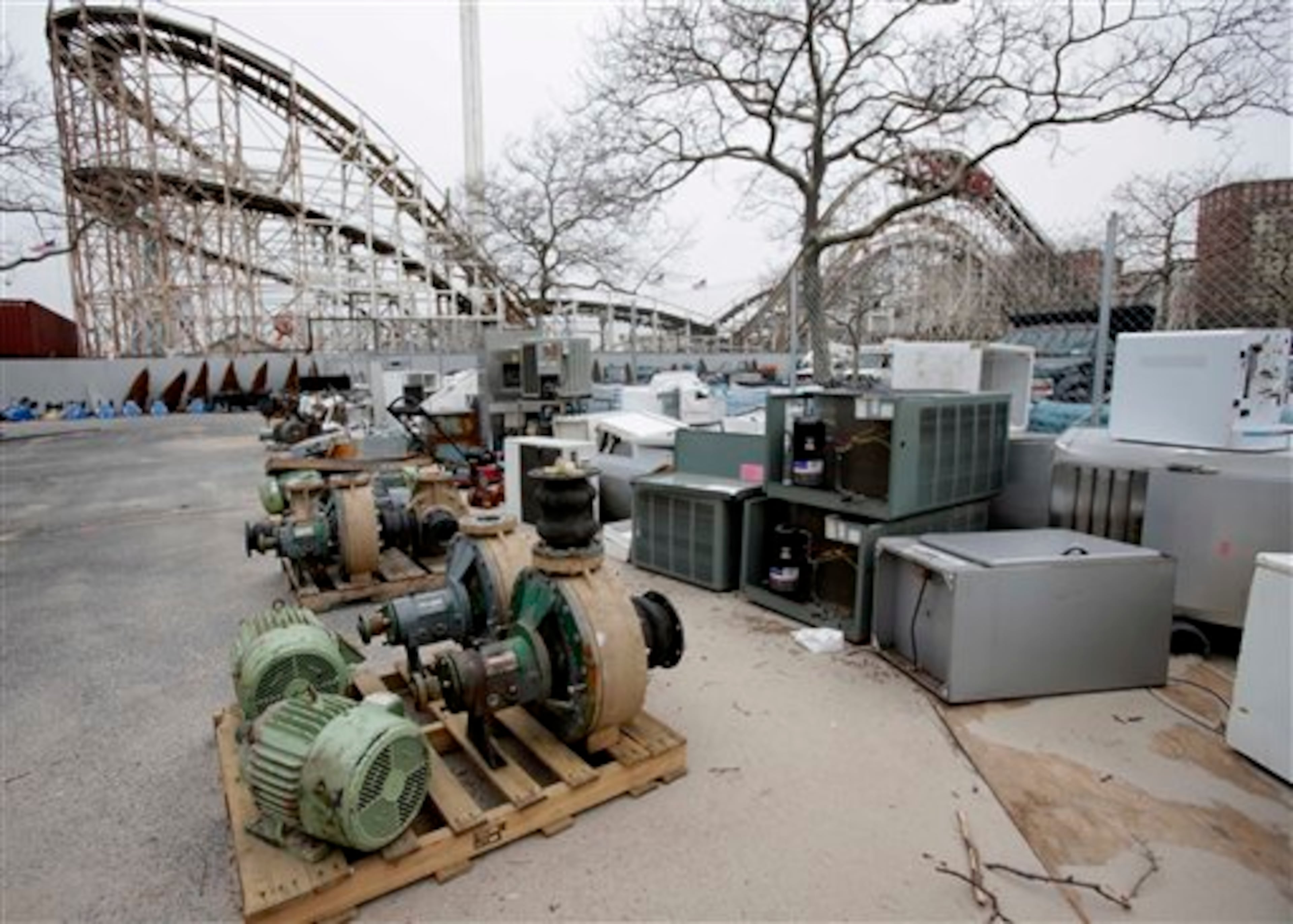 Machinery damaged by Superstorm Sandy is laid out in a parking lot near the Wildlife Conservation Society's New York Aquarium in Coney Island, New York, Monday, March 25, 2013. (AP Photo/Seth Wenig)