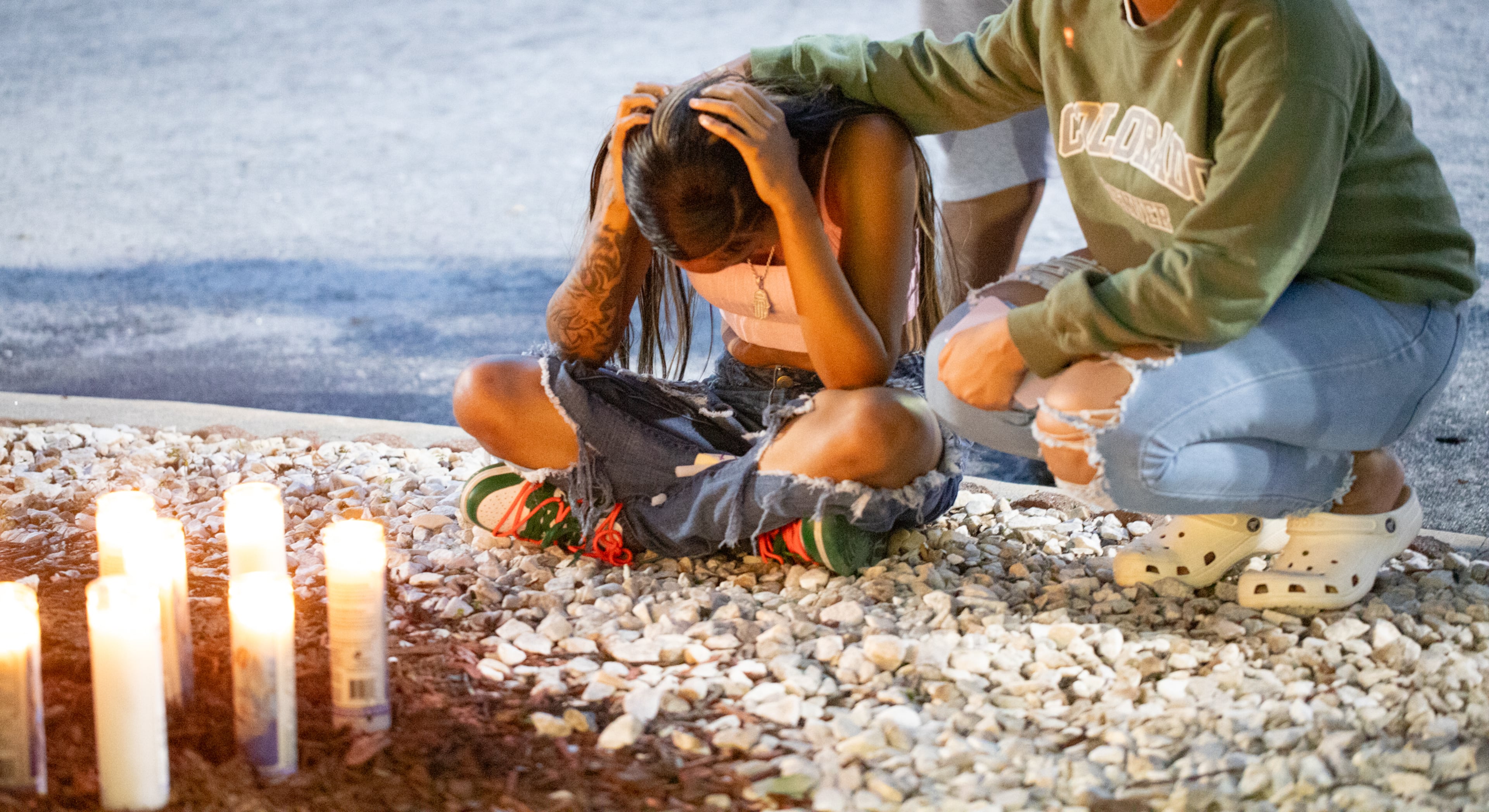 Mecca Johnson, 20, grieves the loss of her brother Jacob Johnson at a candlelight vigil and balloon release Tuesday, July 25, 2023 at the IHOP where he was allegedly killed by another teenager this month.