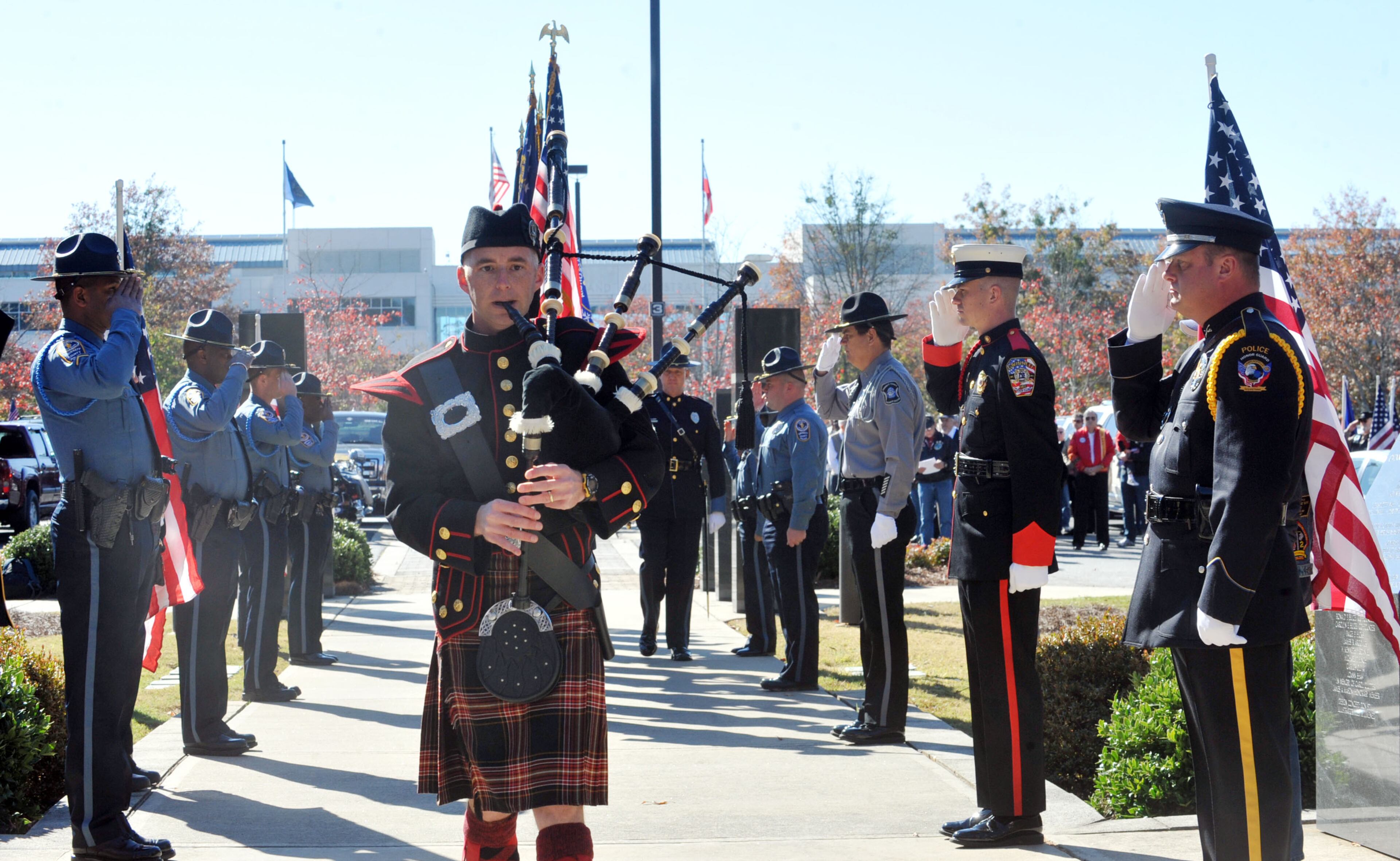 Jeff Kendrick with the Gwinnett County Fire Deaprtment, plays the bagpipes during the presentation of the colors Monday, Nov. 11, 2013 at the Fallen Heroes Memorial in Lawrenceville during Gwinnett County's Veterans Day Ceremony.