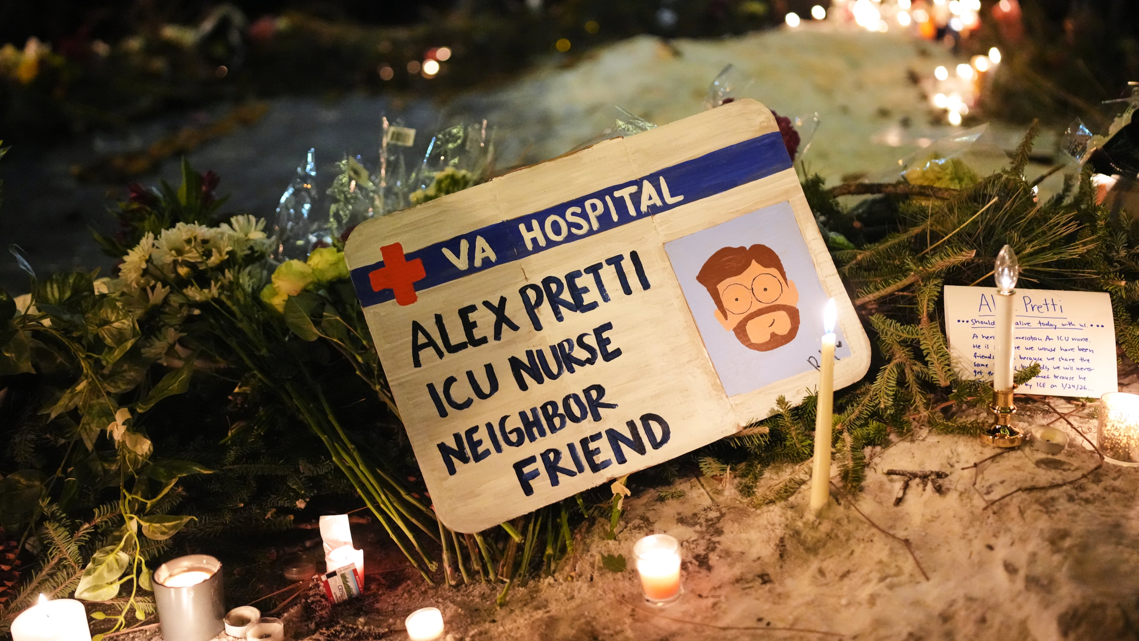 A sign for 37-year-old Alex Pretti, who was fatally shot by a U.S. Border Patrol officer Saturday, Jan. 24, 2026, is displayed during a vigil Saturday night in Minneapolis. (Adam Gray/AP)