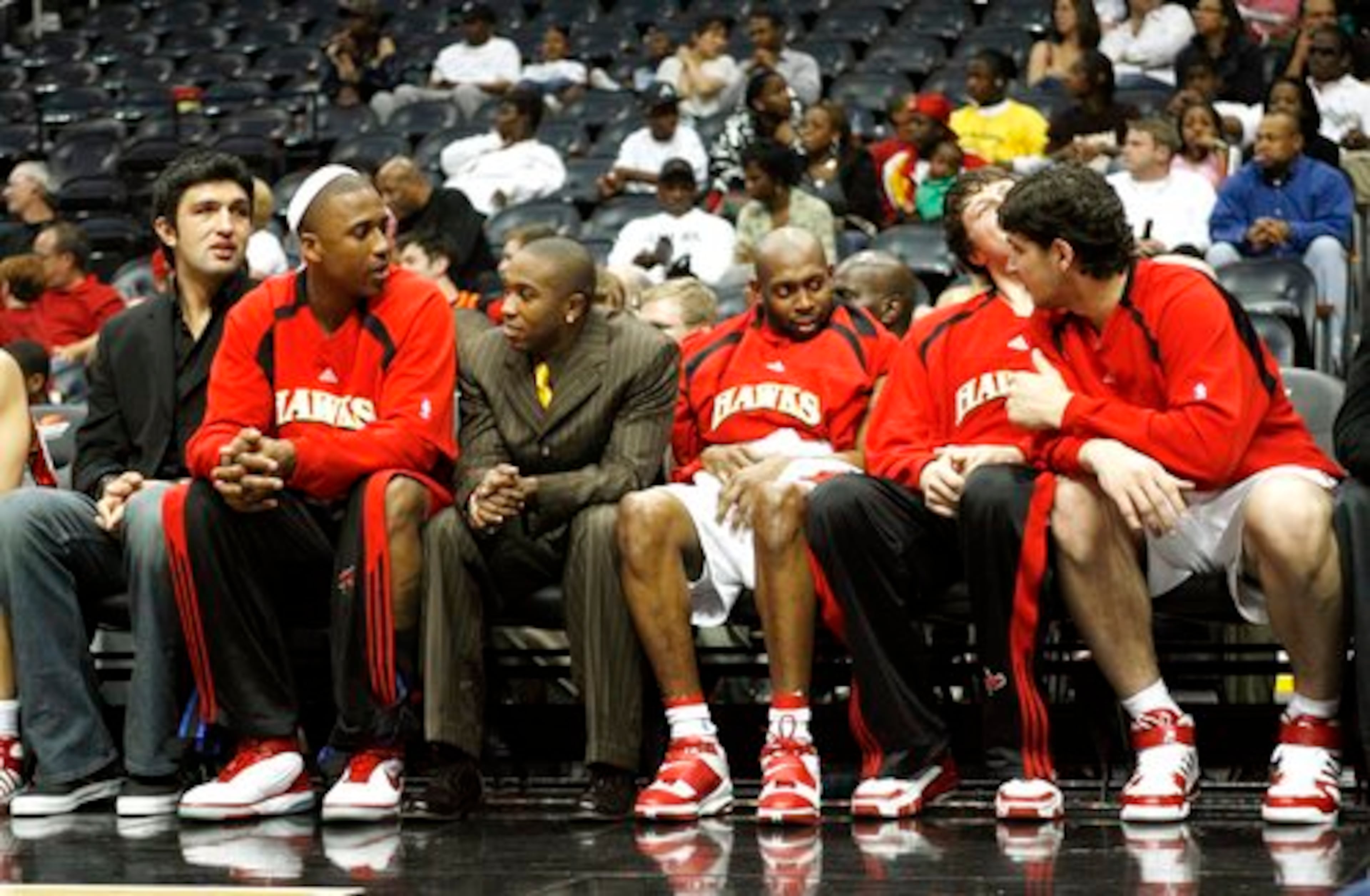 Wright (second from left) and several teammates sit on the bench during the final game of the season.
