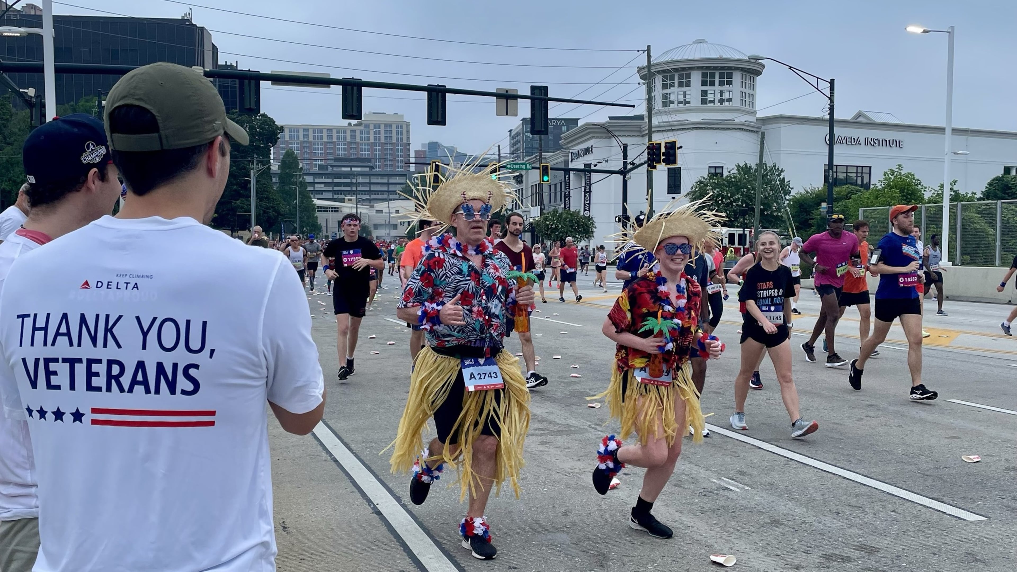 Delta Air Lines employees cheer on runners at the AJC Peachtree Road Race in 2022, part of the airline's decades-long involvement in the race. Courtesy of Delta