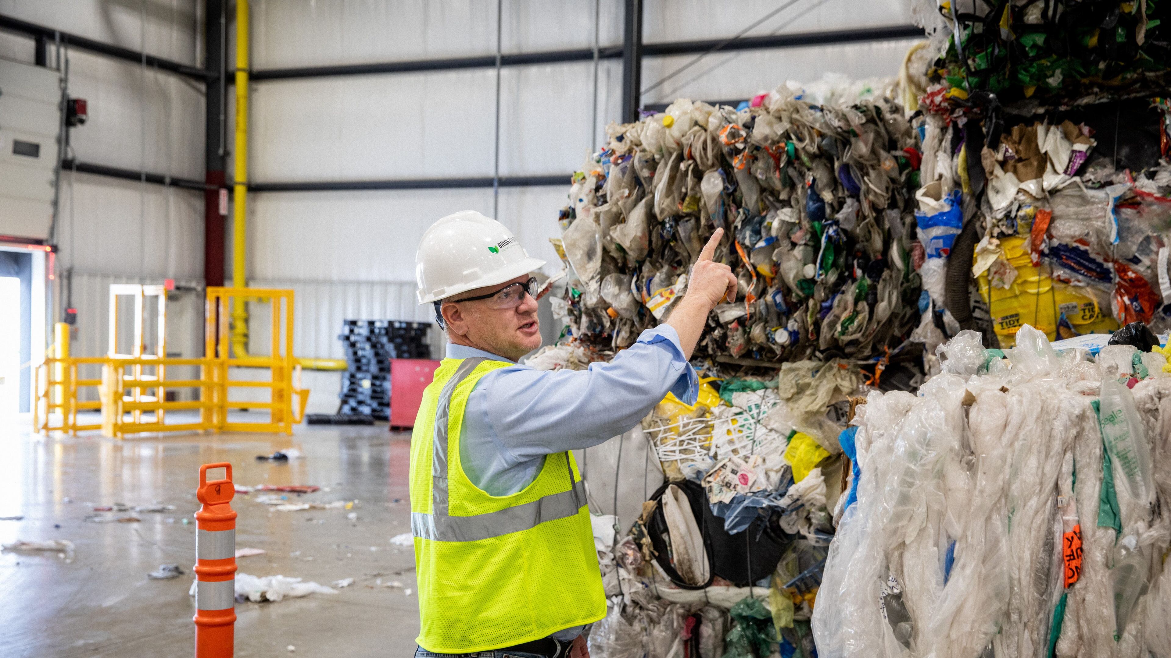 Bob Powell, a Georgia Tech graduate and CEO and founder of Brightmark stands among bales of plastic wastes at a processing plant in Indiana. The company plans to build a massive plastic waste processing plant in Georgia that will turn plastic into diesel fuel, naptha and wax. Powell wants one day to turn the plastic into new plastic, helping solve the massive problem of plastic pollution. But that process isn't economically viable at the moment. Photo courtesy of Brightmark.