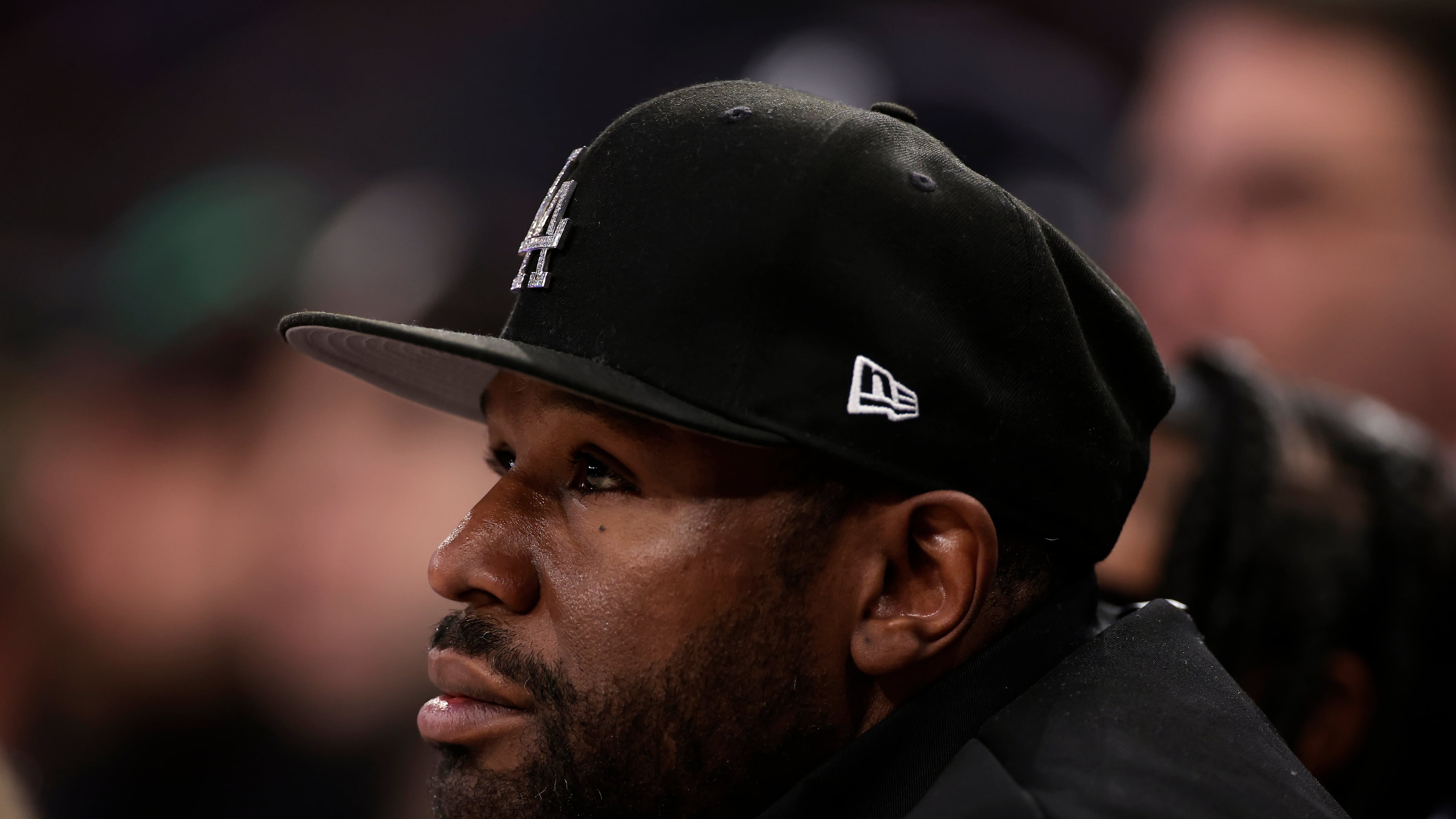 FILE - Boxer Floyd Mayweather Jr. looks on during the first half of an NBA basketball game between the LA Clippers and the New York Knicks, March 26, 2025, in New York. (AP Photo/Adam Hunger, File)