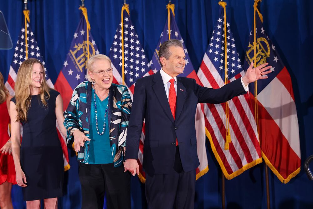 GOP nominee for governor Rick Jackson, with his wife Melody, greets supporters at his election night party at the Westin Atlanta Perimeter North. (Jason Getz/AJC)
