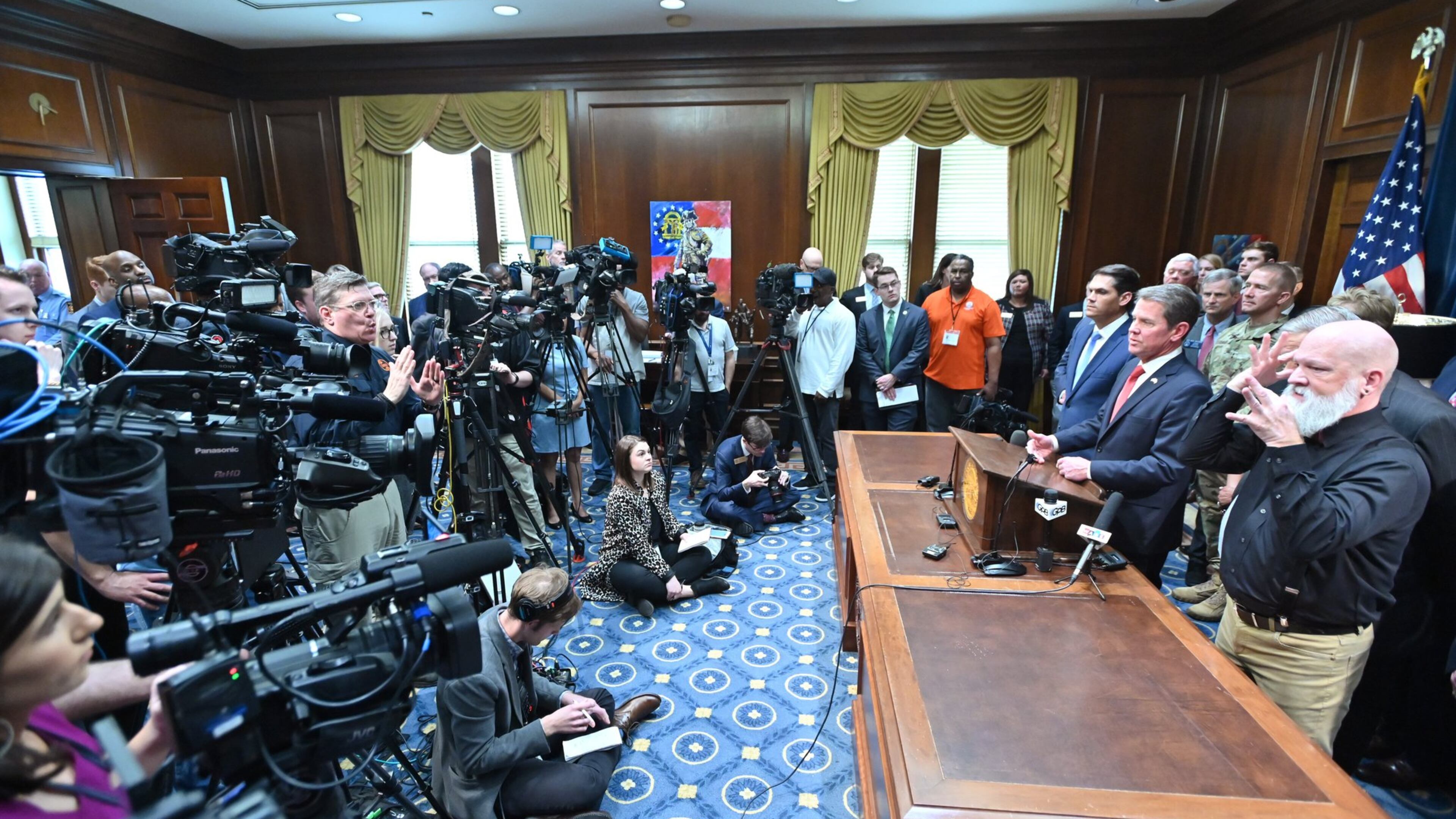 Gov. Brian Kemp speaks as other officials standing behind during a press conference to provide an update on the state’s efforts regarding COVID-19, after reporting the first death in Georgia related to coronavirus, at the Georgia State Capitol on Thursday, March 11, 2020. HYOSUB SHIN / HYOSUB.SHIN@AJC.COM