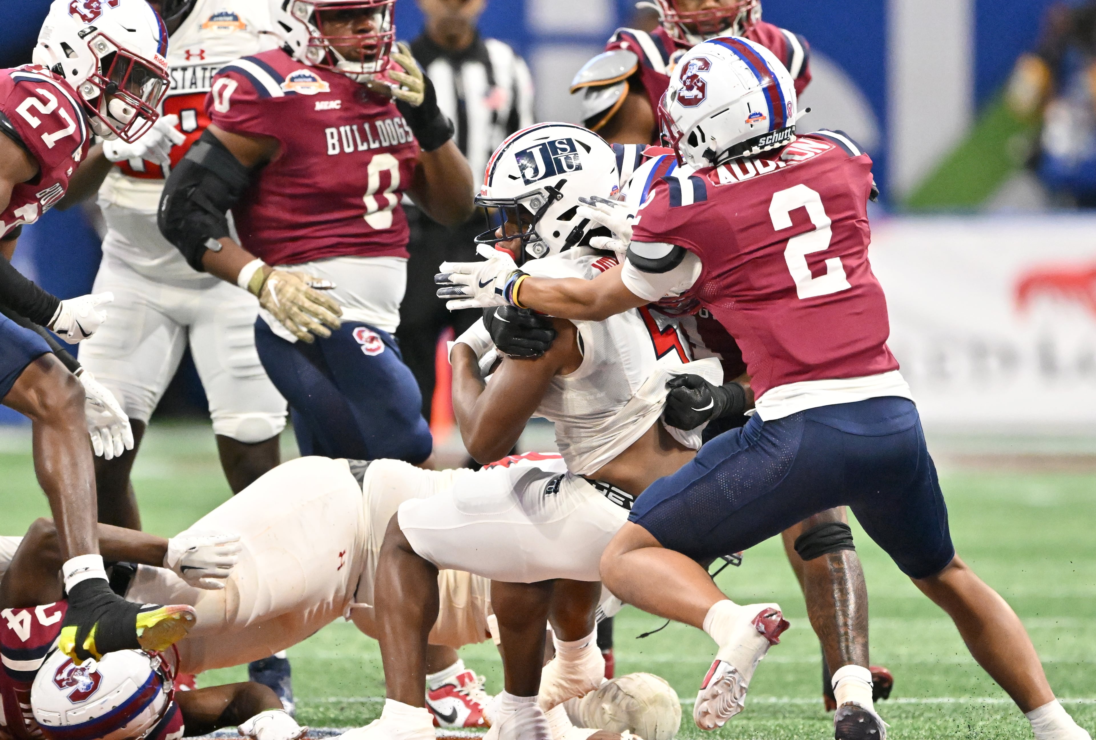 Jackson State running back Irv Mulligan (5) pushes for a first down during the first half in 2024 Cricket Celebration Bowl at Mercedes-Benz Stadium, Saturday, December 14, 2024, in Atlanta. (Hyosub Shin / AJC)