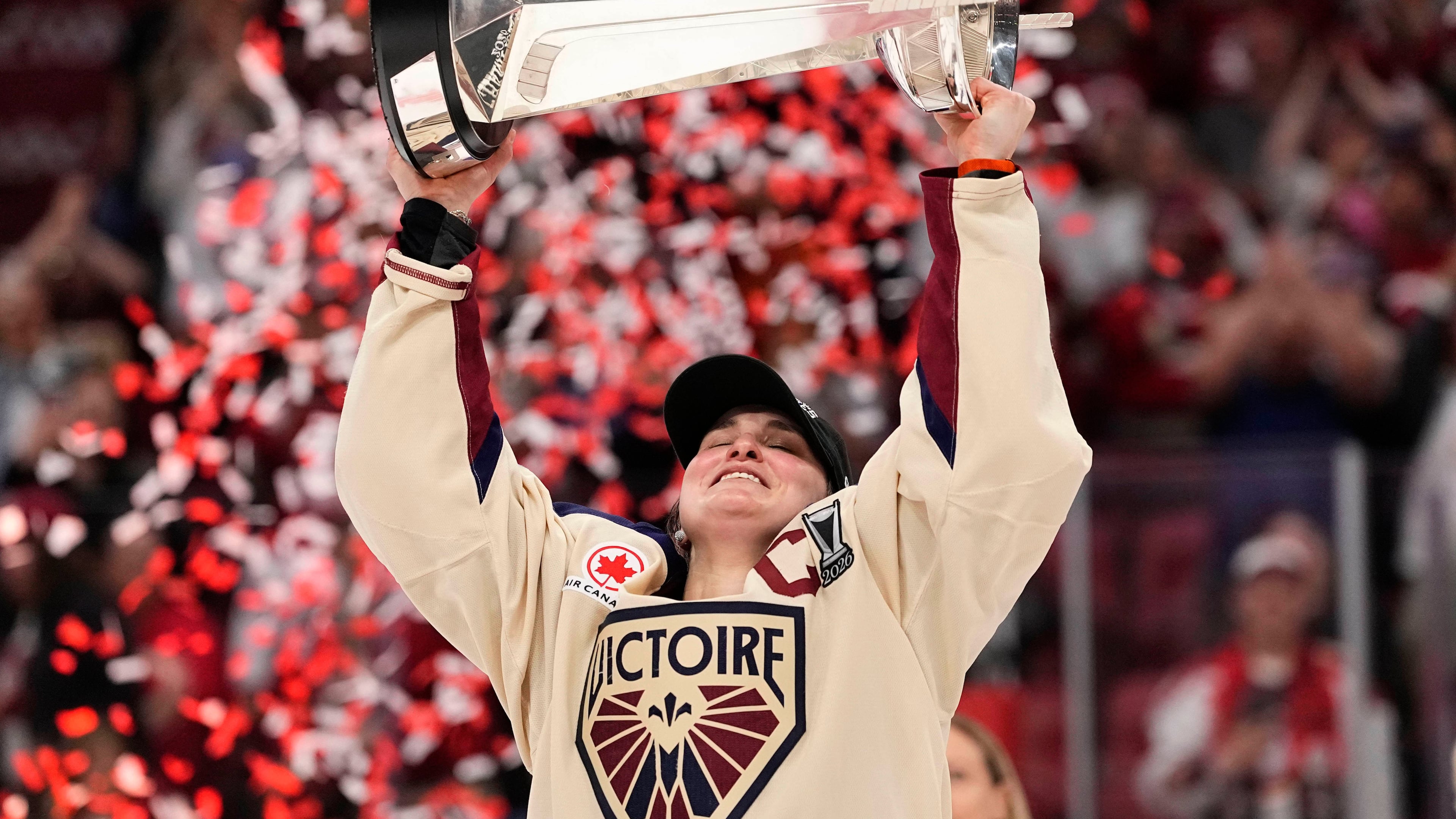 Montreal Victoire's Marie-Philip Poulin (29) raises the PWHL Walter Cup after the team's win against the Ottawa Charge, in Ottawa, on Wednesday, May 20, 2026. (Adrian Wyld/The Canadian Press via AP)