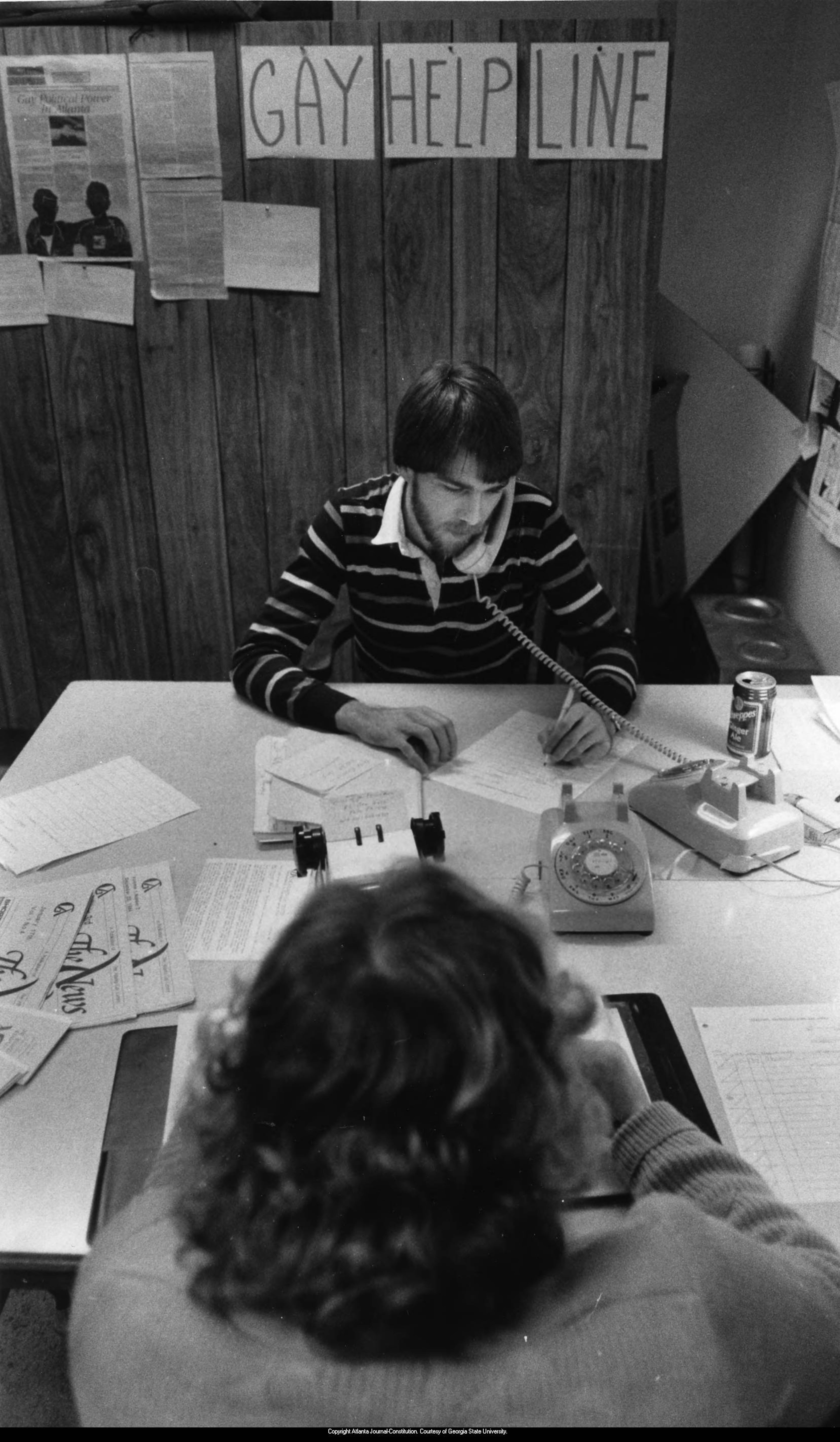 Michael Wilson mans the phones for Gay Help Line at the Atlanta Gay Center in Atlanta, Georgia, February 1985. PHOTO BY JOHN SPINK / AJC ARCHIVES