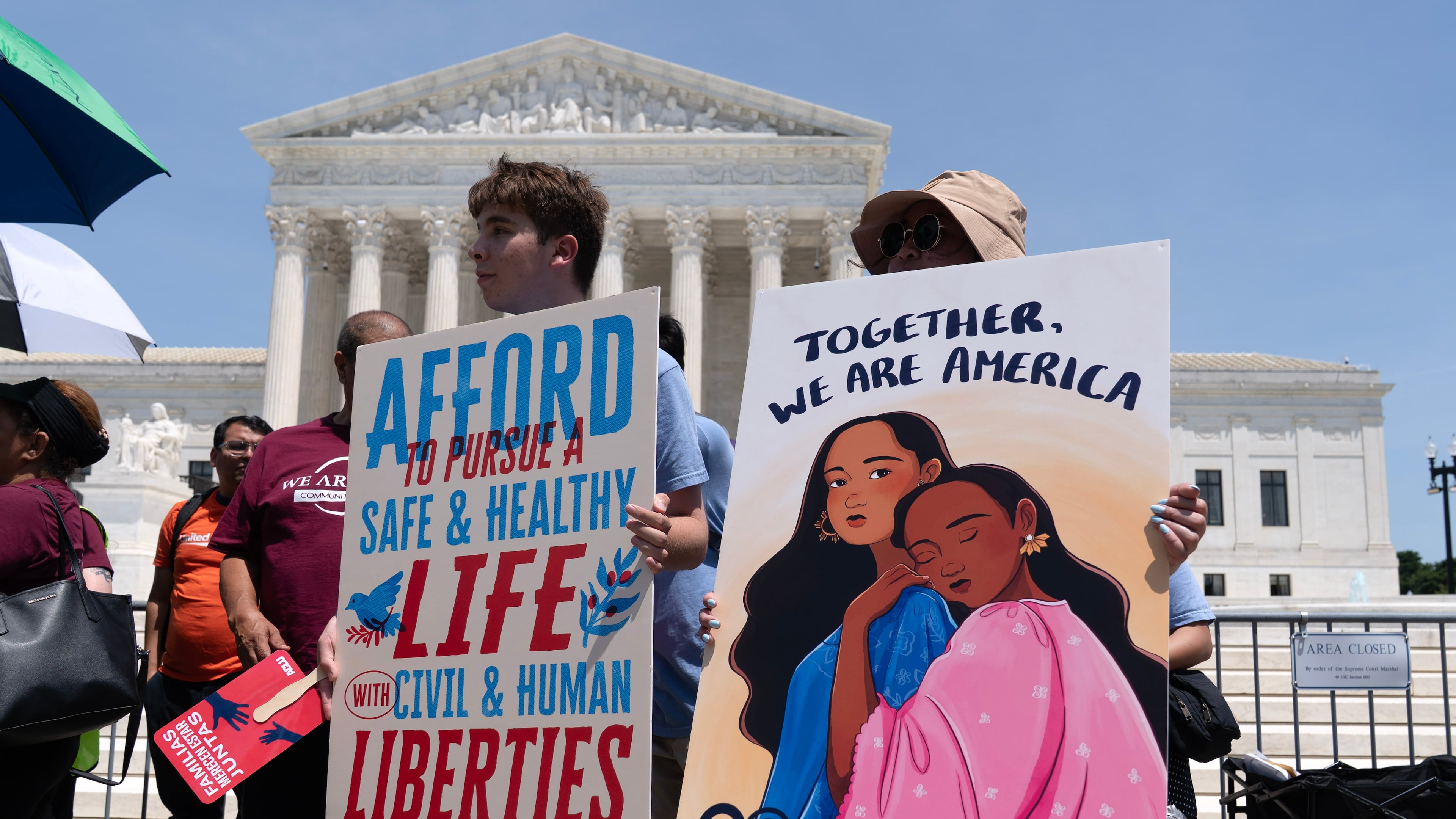 Activists celebrate the Supreme Court's ruling on birthright citizenship, outside of the Supreme Court on Capitol Hill, Tuesday, June 30, 2026, in Washington. (AP Photo/Jose Luis Magana)