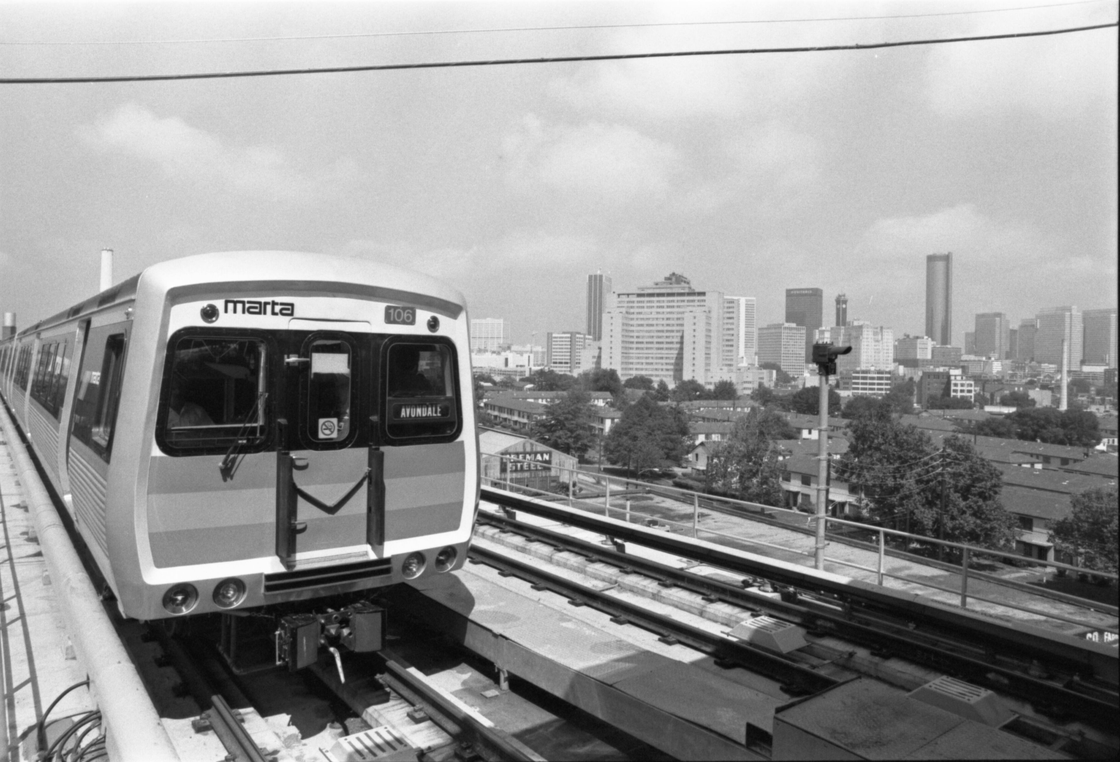 MARTA's commuter rail system made its debut on June 30, 1979. The service began on what's now the eastern section of the Blue and Green rail lines. In the background is the Atlanta skyline. AP Laserphoto/71300str/SH). 1979.