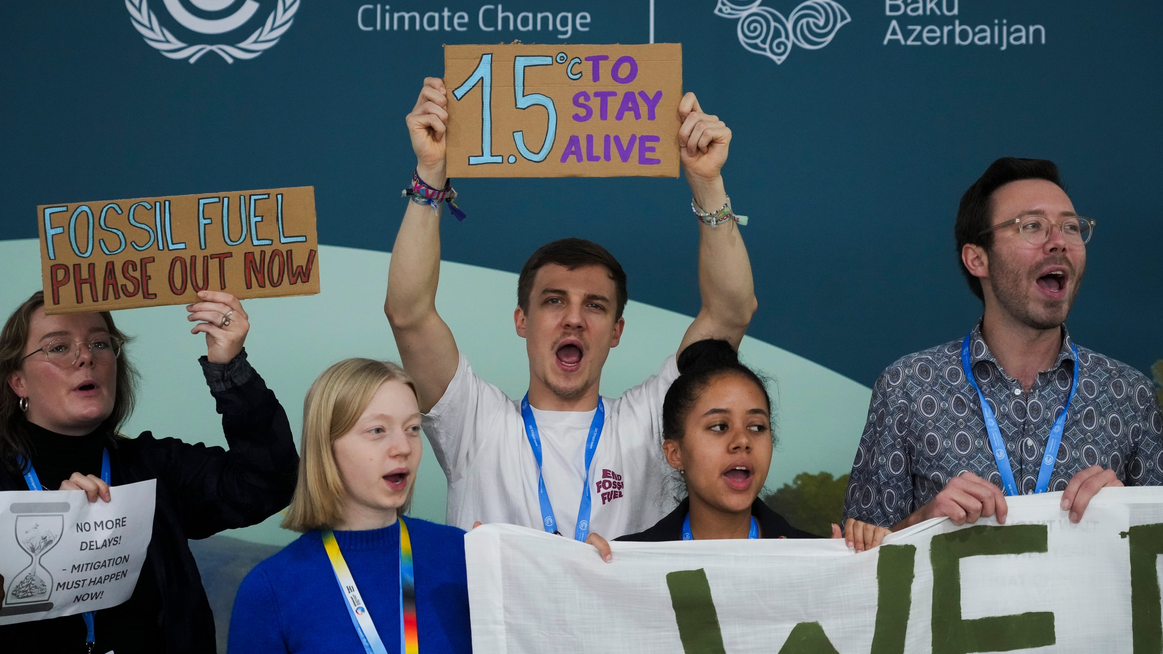 FILE - Activists participate in a demonstration for phasing out fossil fuels at the COP29 U.N. Climate Summit, Nov. 19, 2024, in Baku, Azerbaijan. (AP Photo/Sergei Grits, File)