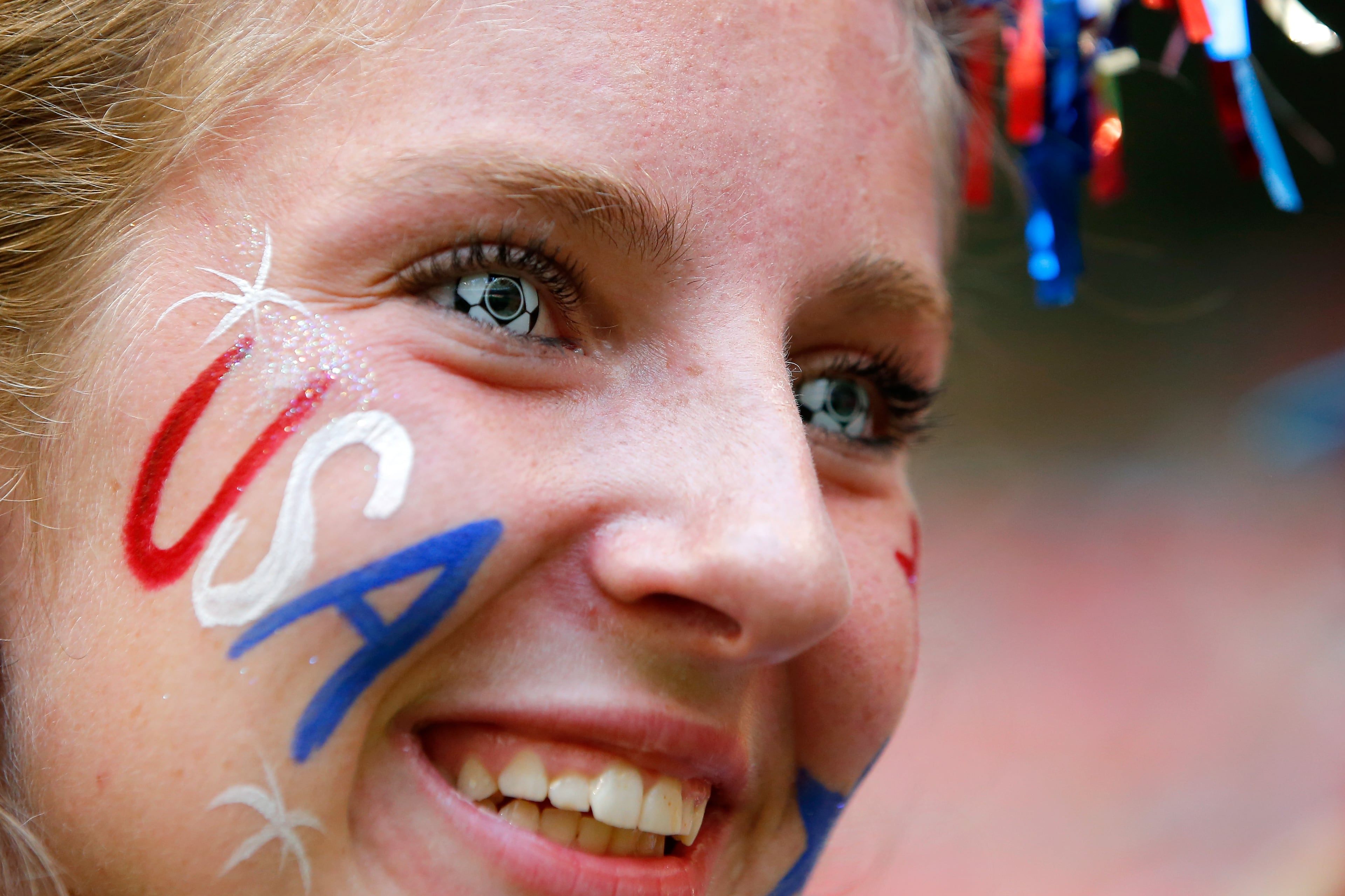 VANCOUVER, BC - JULY 05: A fan of the United States watches warm-ups as she has in soccer contact lenses before the USA takes on Japan in the FIFA Women's World Cup Canada 2015 Final at BC Place Stadium on July 5, 2015 in Vancouver, Canada. (Photo by Kevin C. Cox/Getty Images)