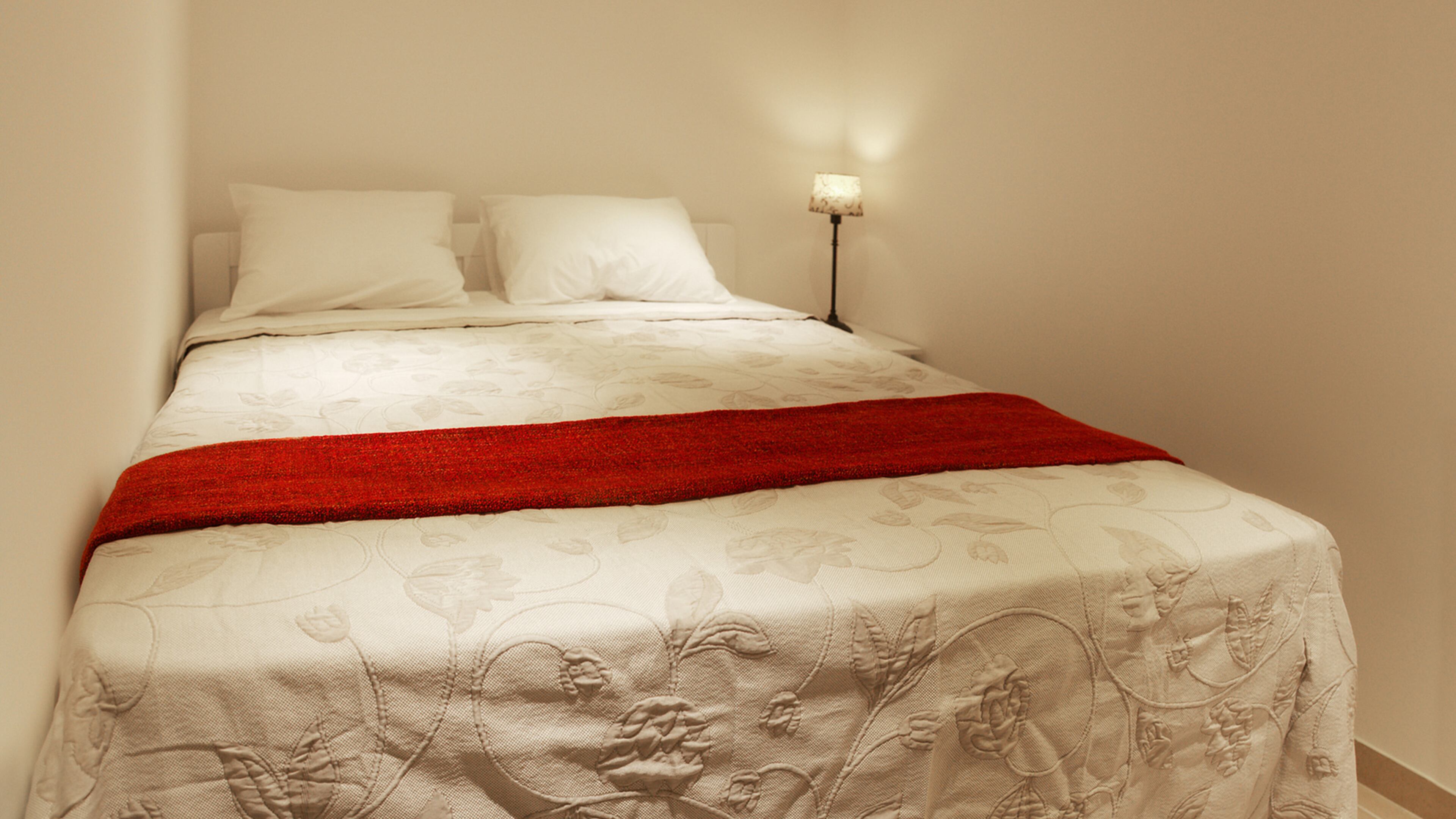 Want to get that plush hotel look? Try going all white: walls, ceiling, floors, furniture, and, most importantly, bedding. (Dreamstime)