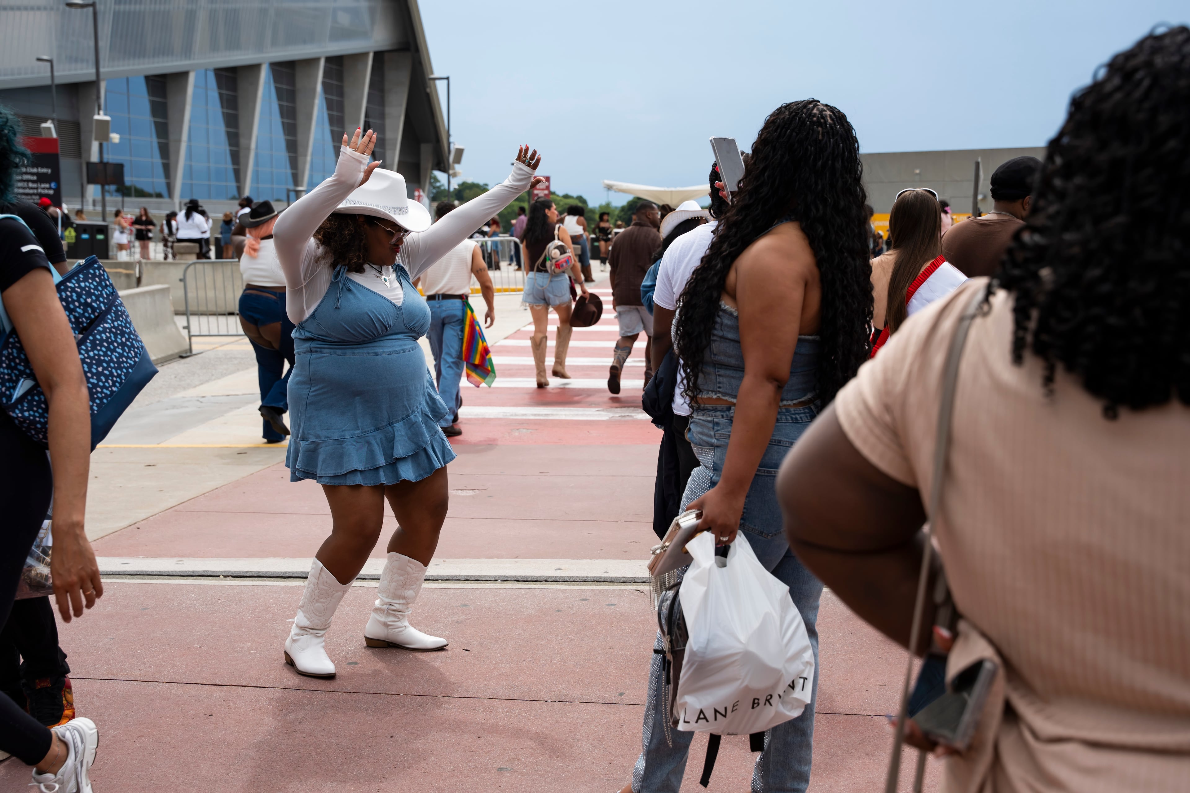 Fans dance excitedly in line at Beyoncé's Cowboy Carter concert in Atlanta on Thursday, July 10, 2025. (Olivia Bowdoin for the AJC)