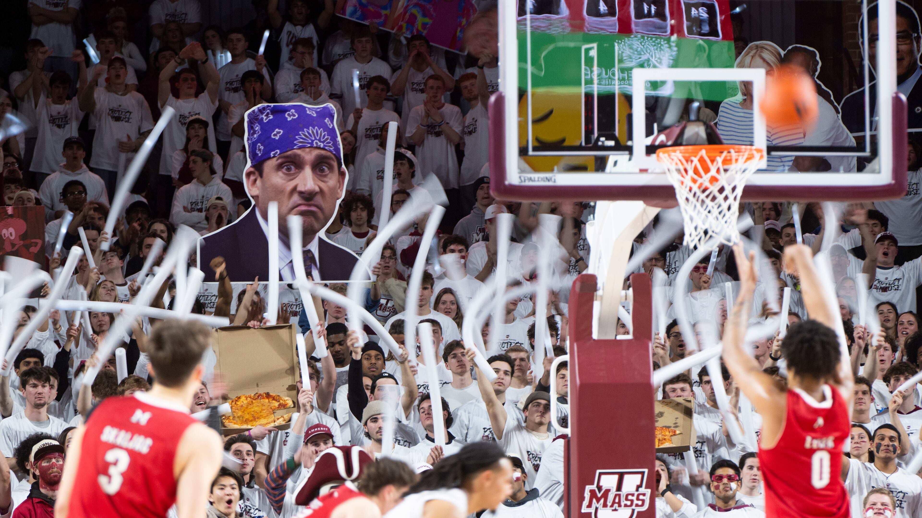 The Massachusetts student section cheers as Miami Ohio wing Eian Elmer (0) attempts a free throw during the NCAA basketball game at The Mullins Center in Amherst, Mass., Tuesday, Feb. 17, 2026. (Daniel Jacobi II/The Daily Hampshire Gazette via AP)