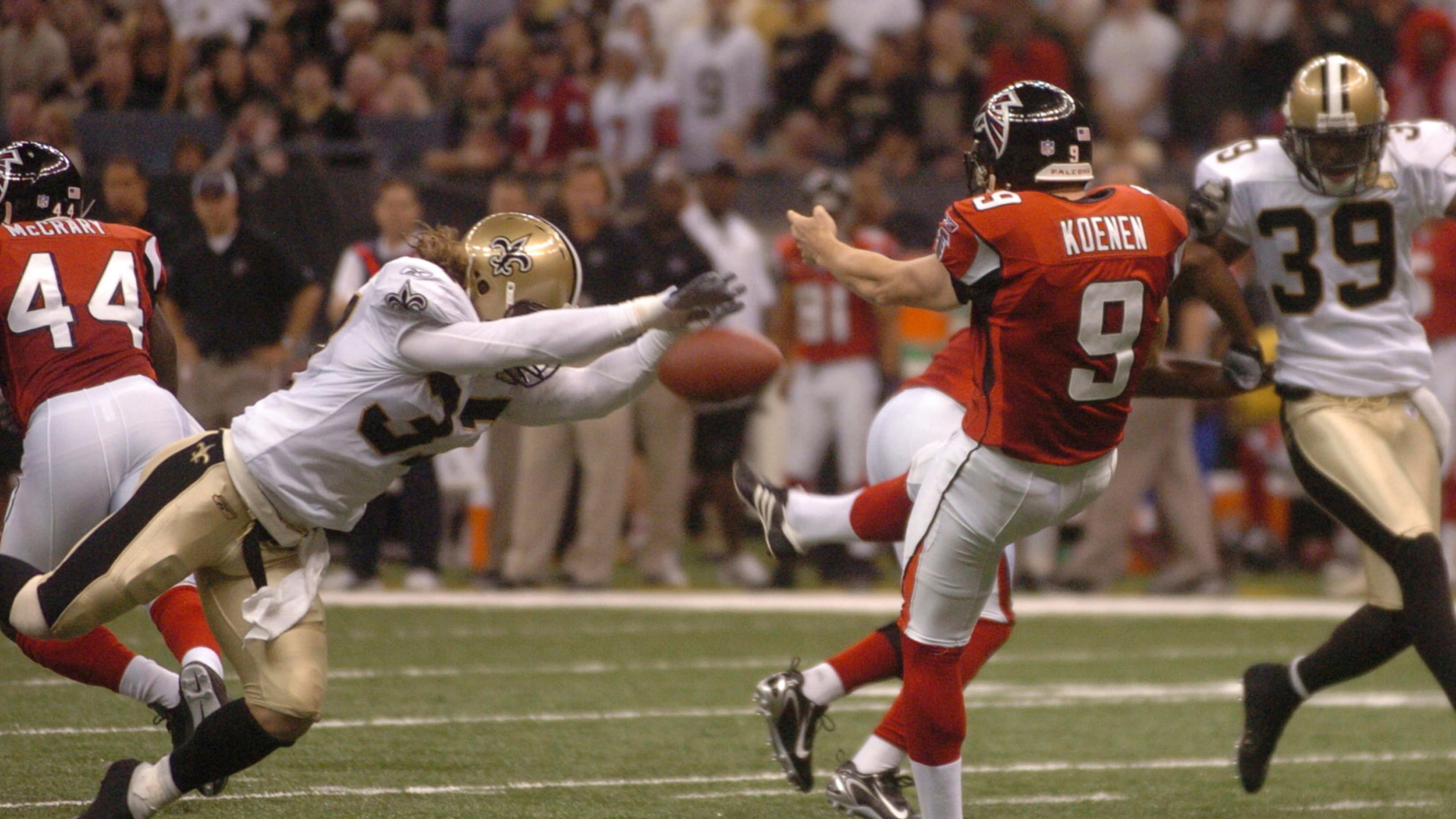 FILE - New Orleans Saints' Steve Gleason blocks a punt which the Saints ran in for the first score of an NFL football game against the Atlanta Falcons, at the Louisiana Superdome in New Orleans, Sept. 25, 2006. (Michael DeMocker/The Advocate via AP)