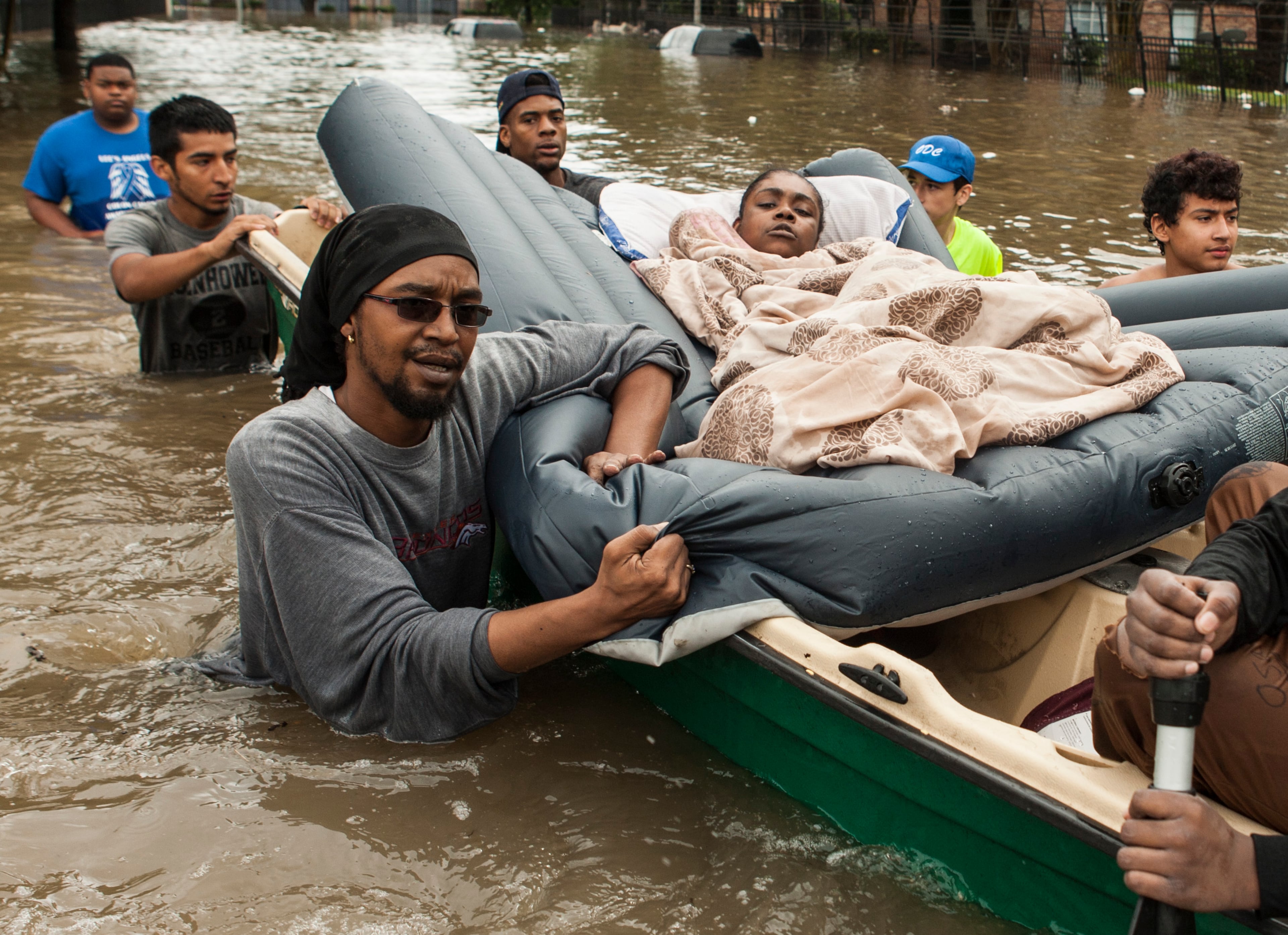 Residents of the Arbor Court apartments evacuate their flooded apartment complex in the Greenspoint area on Monday, April 18, 2016, in The Woodlands, Texas. (Brett Coomer/Houston Chronicle via AP)